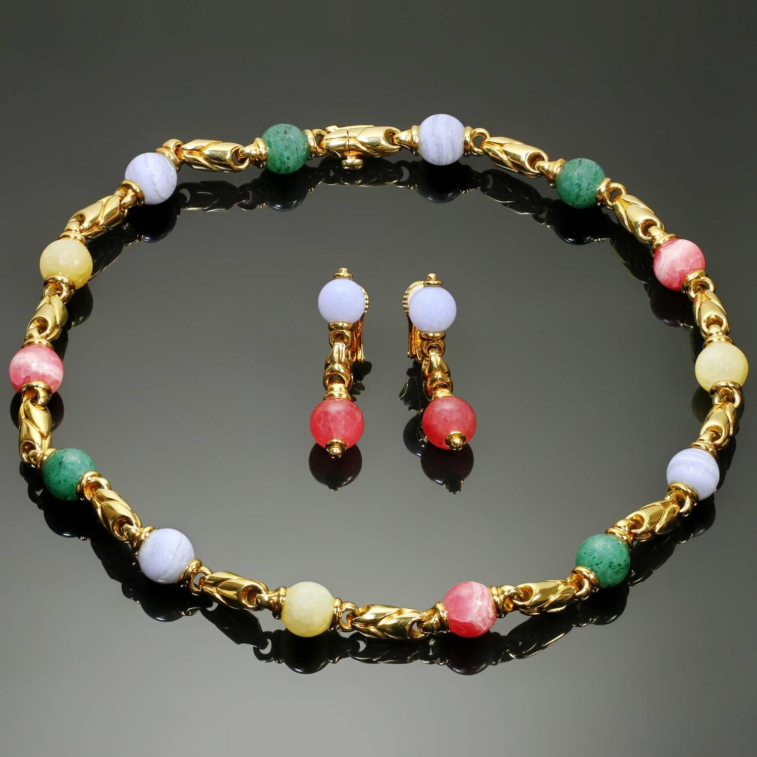 This gorgeous Bulgari jewelry set features a link necklace with a matching pair of drop earrings crafted in 18k yellow gold and set with vibrant gemstone beads made of chalcedony, rhodochrosite, and aventurine quartz. Made in Italy circa 1990s.