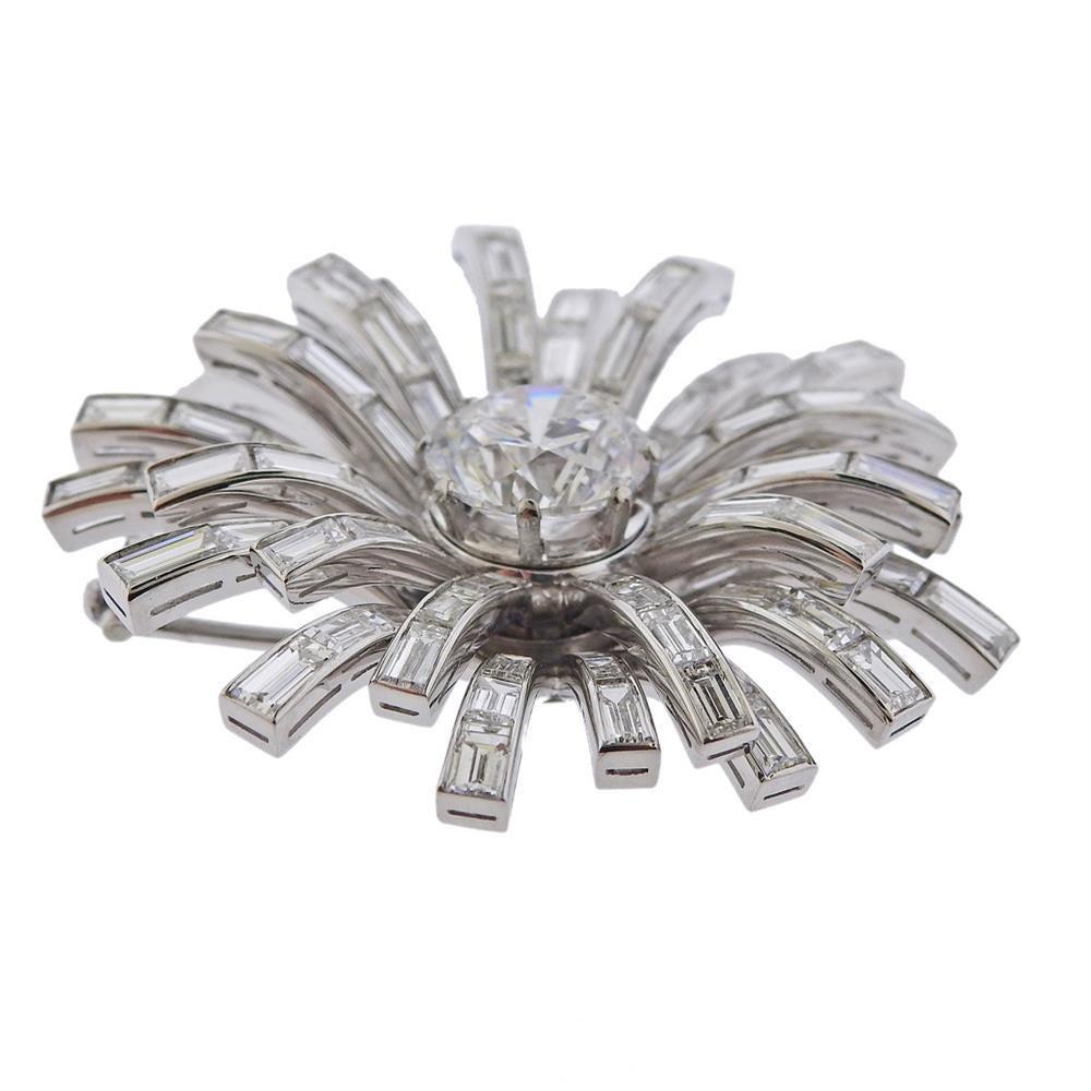 Platinum brooch by Bvlgari, set with center GIA certified 4.22 SI1/D diamond, surrounded wit approx. 7-8ctw in baguette diamonds. Brooch is 44mm x 43mm. Marked Blvgari, Platinum. Weight - 27.9 grams.PB-03096