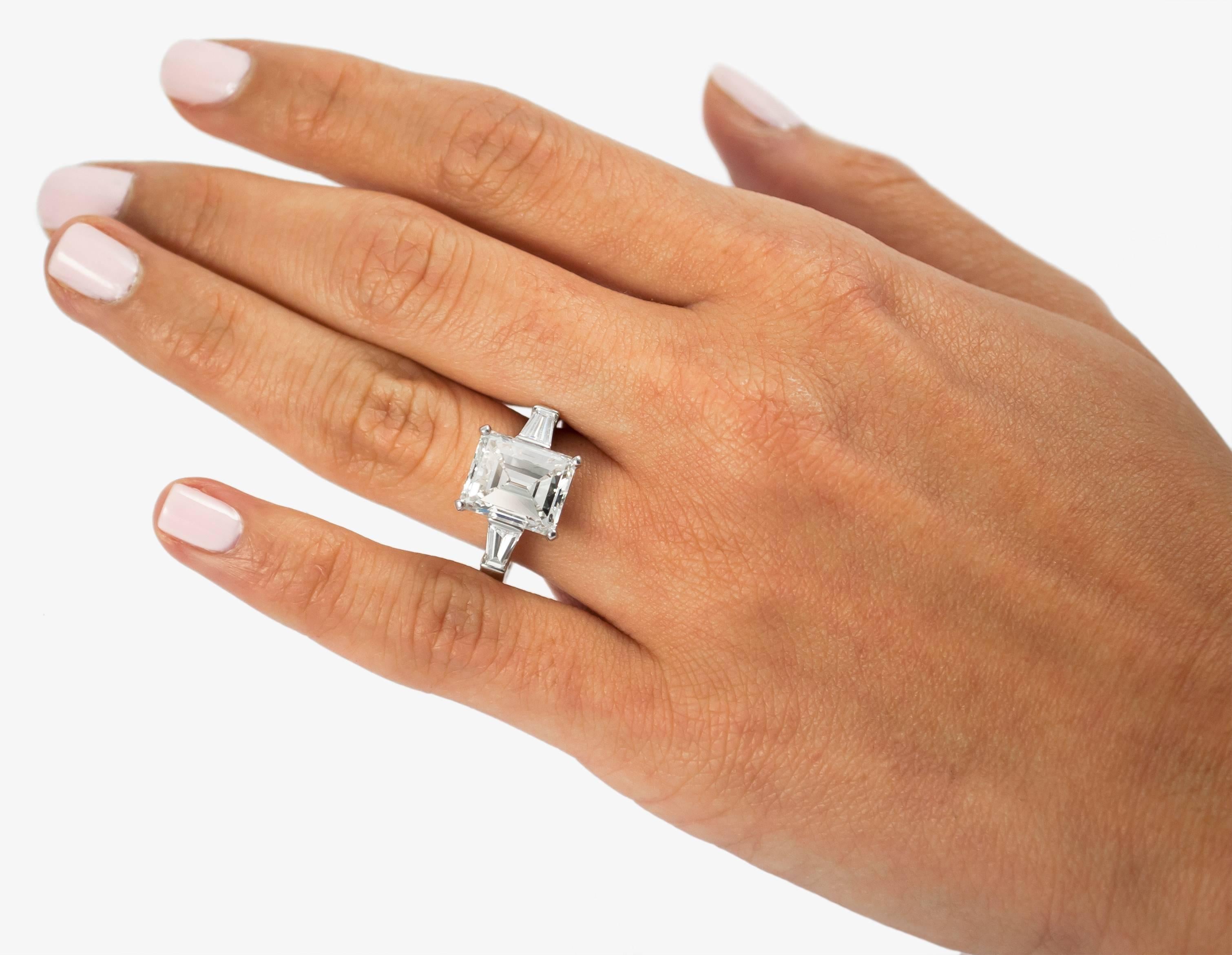 Classic BULGARI ring with tapered baguettes and made in platinum. Being of H color and VVS2 clarity it is a timeless piece that will never go out of style.

This ring comes with a GIA Certificate #1172227302 that states this diamond is of H color