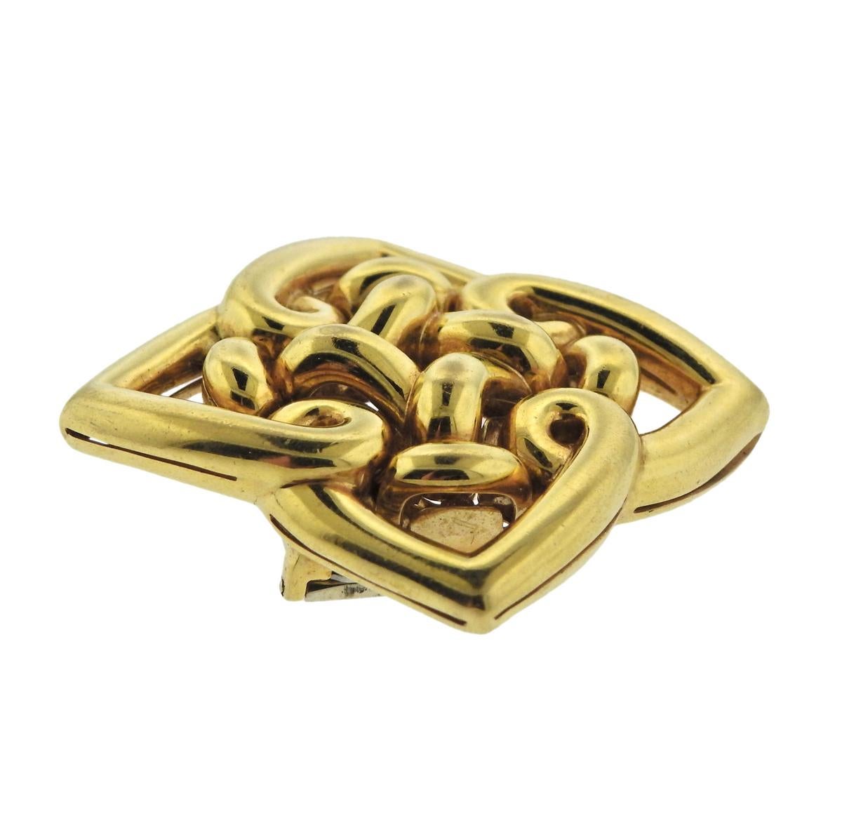 18k yellow gold brooch, designed by Bulgari. Brooch is 48mm x 48mm, weighs 30.8 grams. Marked Bvlgari, 750, 2337Al, made in Italy.