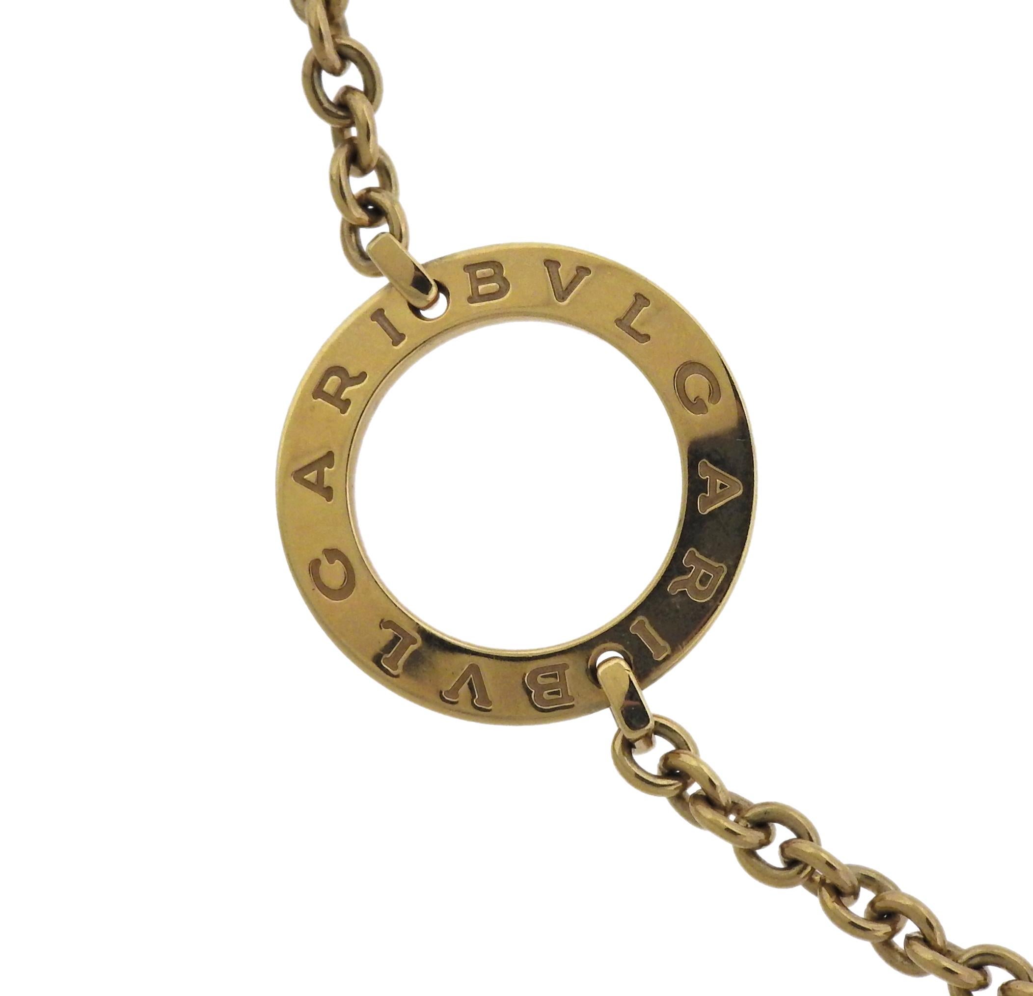 18k gold long circle station necklace, crafted by Bulgari.  Necklace is 36