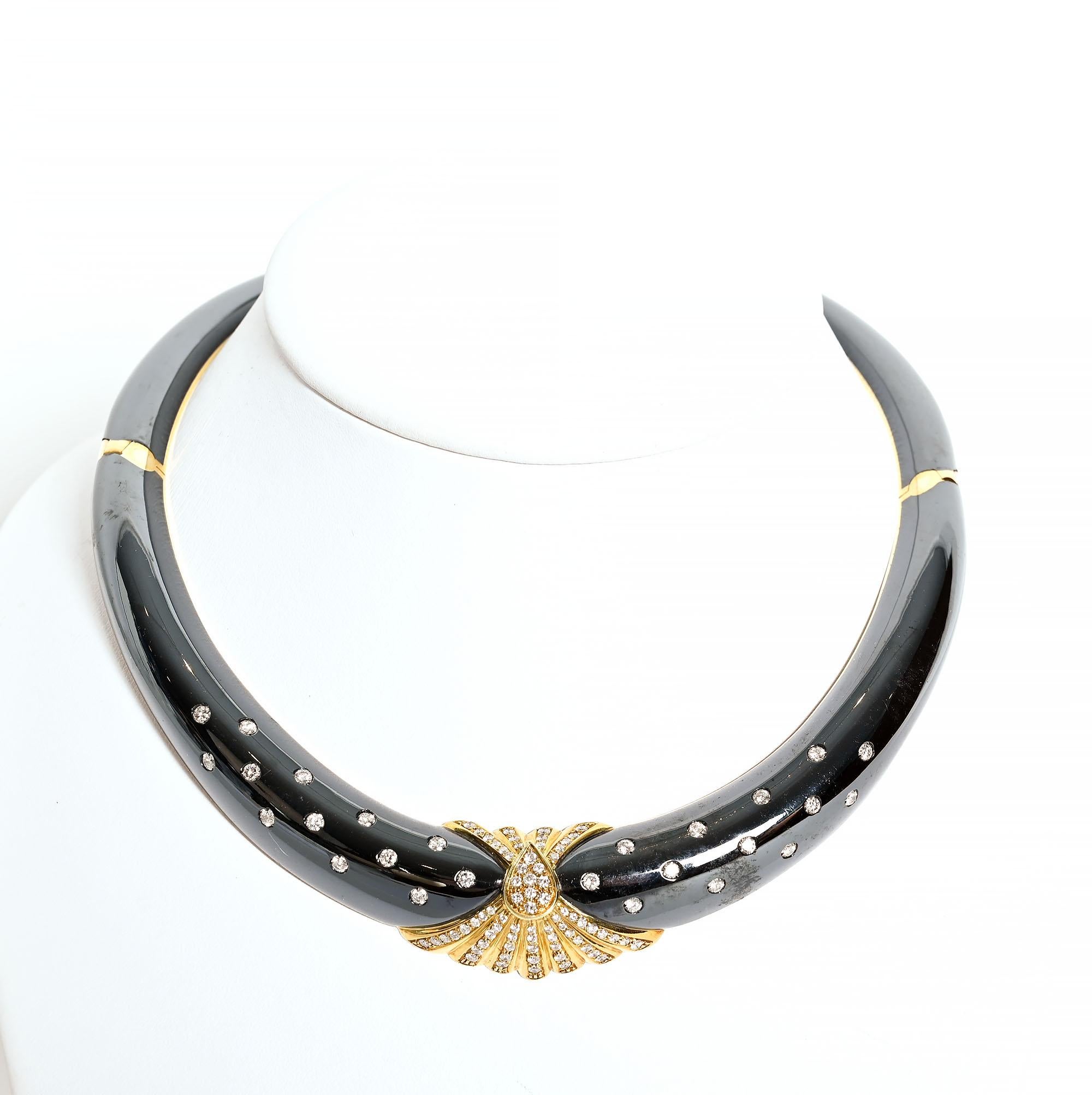 Absolutely smashing choker necklace by Bulgari with black enamel; gold and diamonds. The body of the necklace is sprinkled with 26 diamonds weighing approximately 2.5 carats. The center element has approximately 3.6 carats of diamonds encircling the