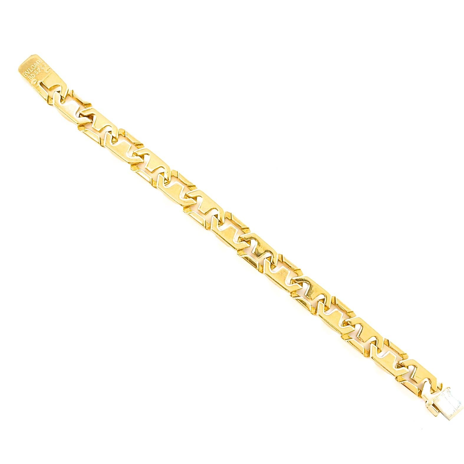 Bulgari's style is mysterious and unconventionally unique which has set them apart from others for centuries. Using deeply rooted Roman influences in all their creations. Featuring glistening 18k gold interlocking link after link. Signed Bvlgari.