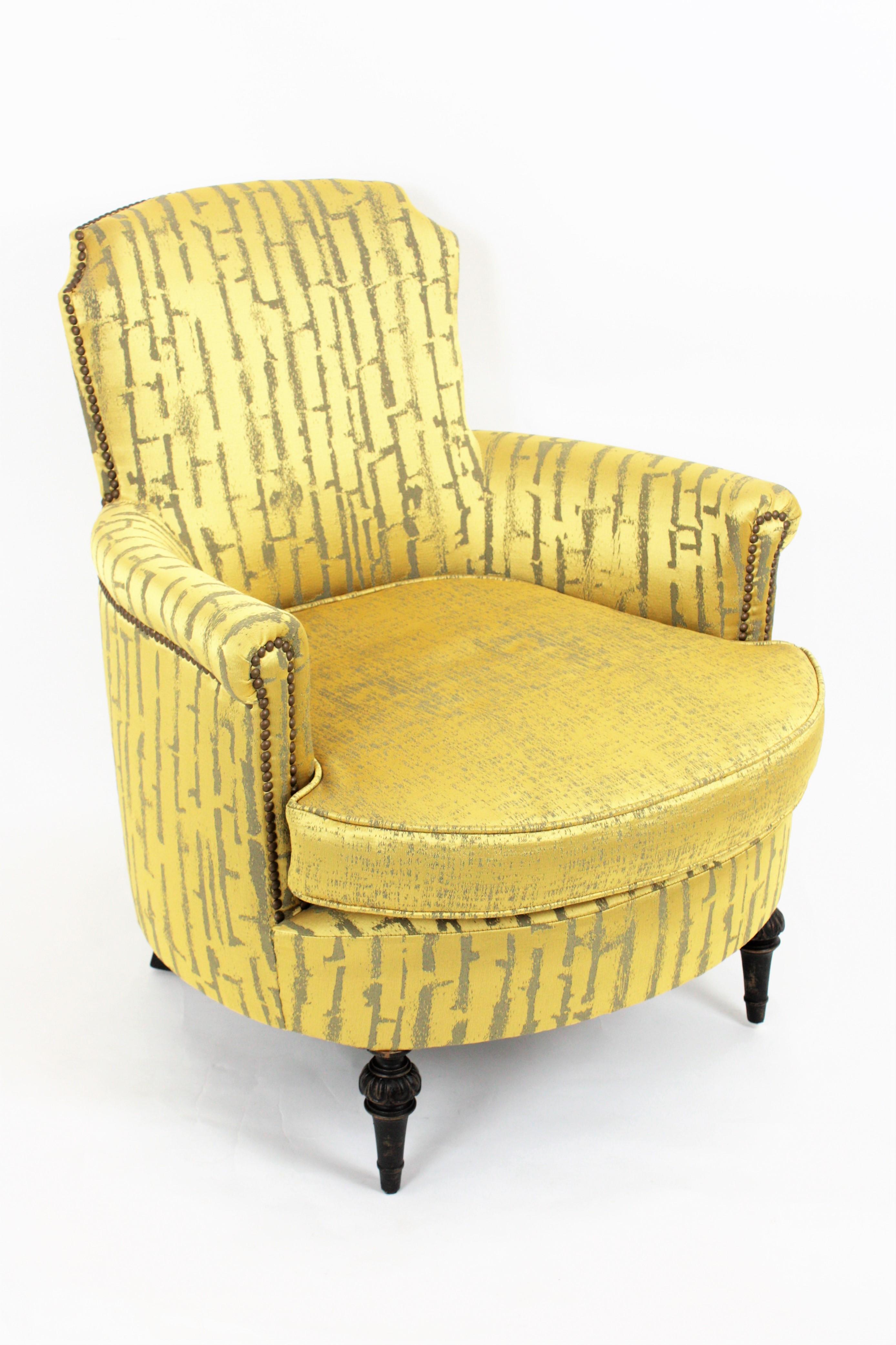 Elegant and comfortable Louis XVI Gustavian armchair with ebonized wood legs upholstered in Damask modern fabric. It has been professionally upholstered including seat, arms and back with new padding and it is covered with gold-lime green Damask
