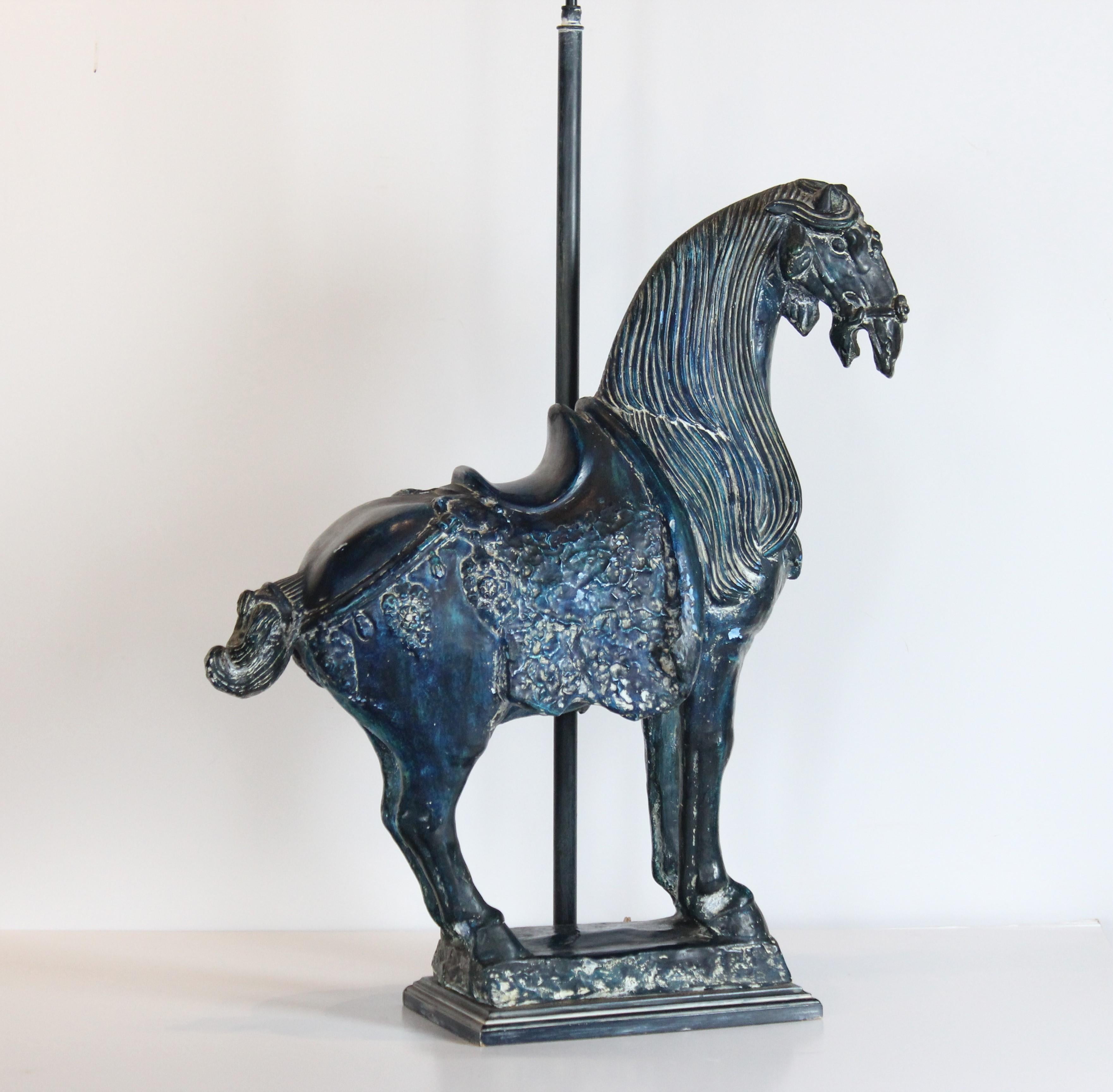 Asian horse stained in blue costume made into a table lamp. The base is wood. Wired for US. Lamp 37