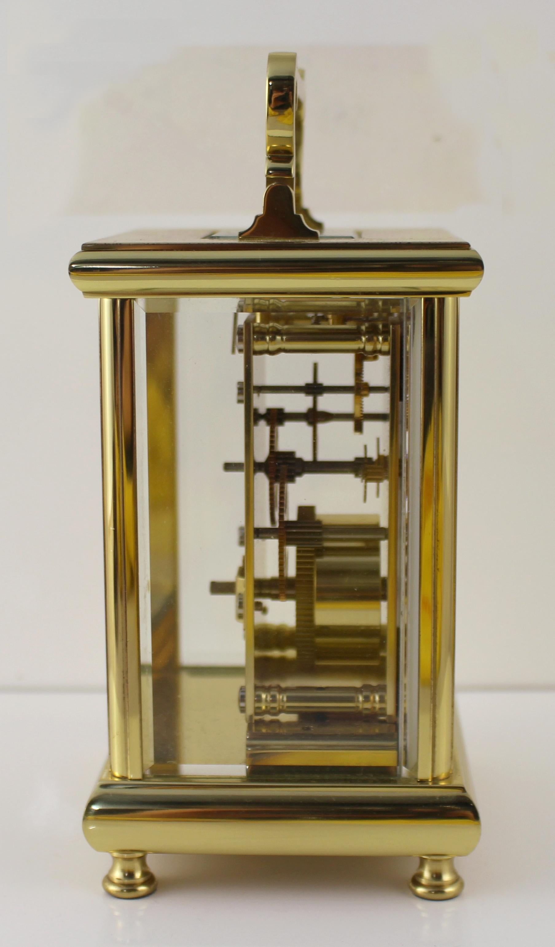 Maker Woodford, made in England.
Measures: Width 9.5 cm / 3 3/4 in
Depth 8 cm / 3 1/4 in
Height (handle up) 17.5 cm / 6 3/4 in
Movement Fully working eight day mechanical movement
Face White enamel dial with Roman numerals and Arabic seconds.