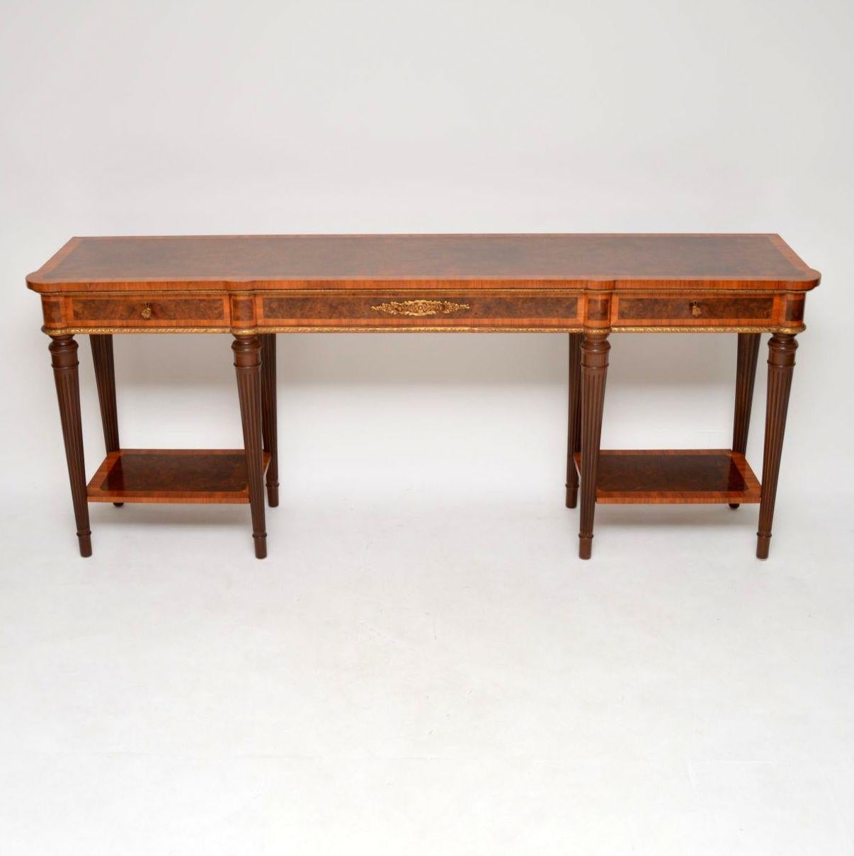 Very large impressive antique French style burr walnut and Kingwood console table of exceptional quality. It’s just been French polished, so is in excellent condition and I would date it to around the 1930s period. This table is such good quality