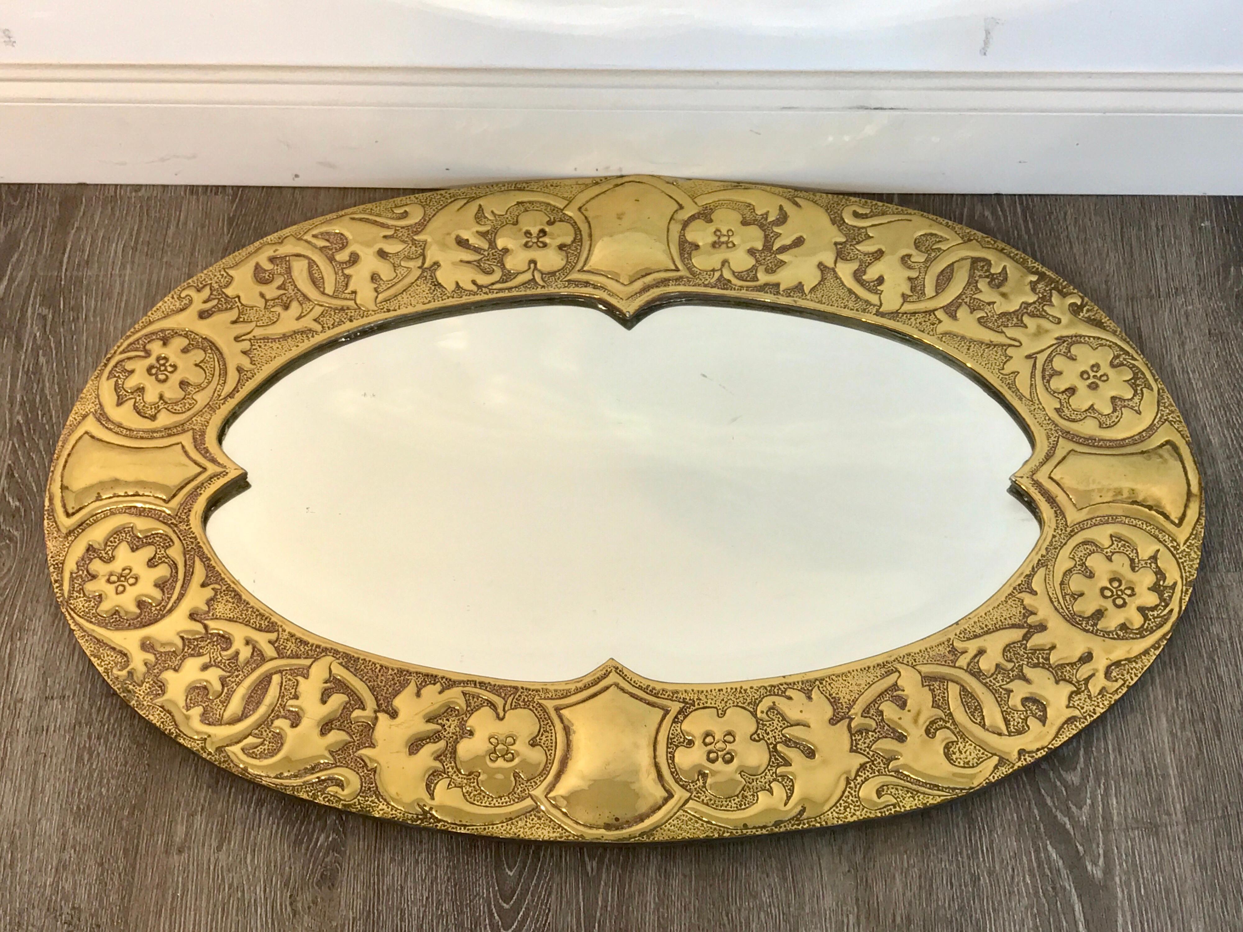 Irish Arts and Crafts oval brass mirror, attributed to the Glasgow School, with inset 29