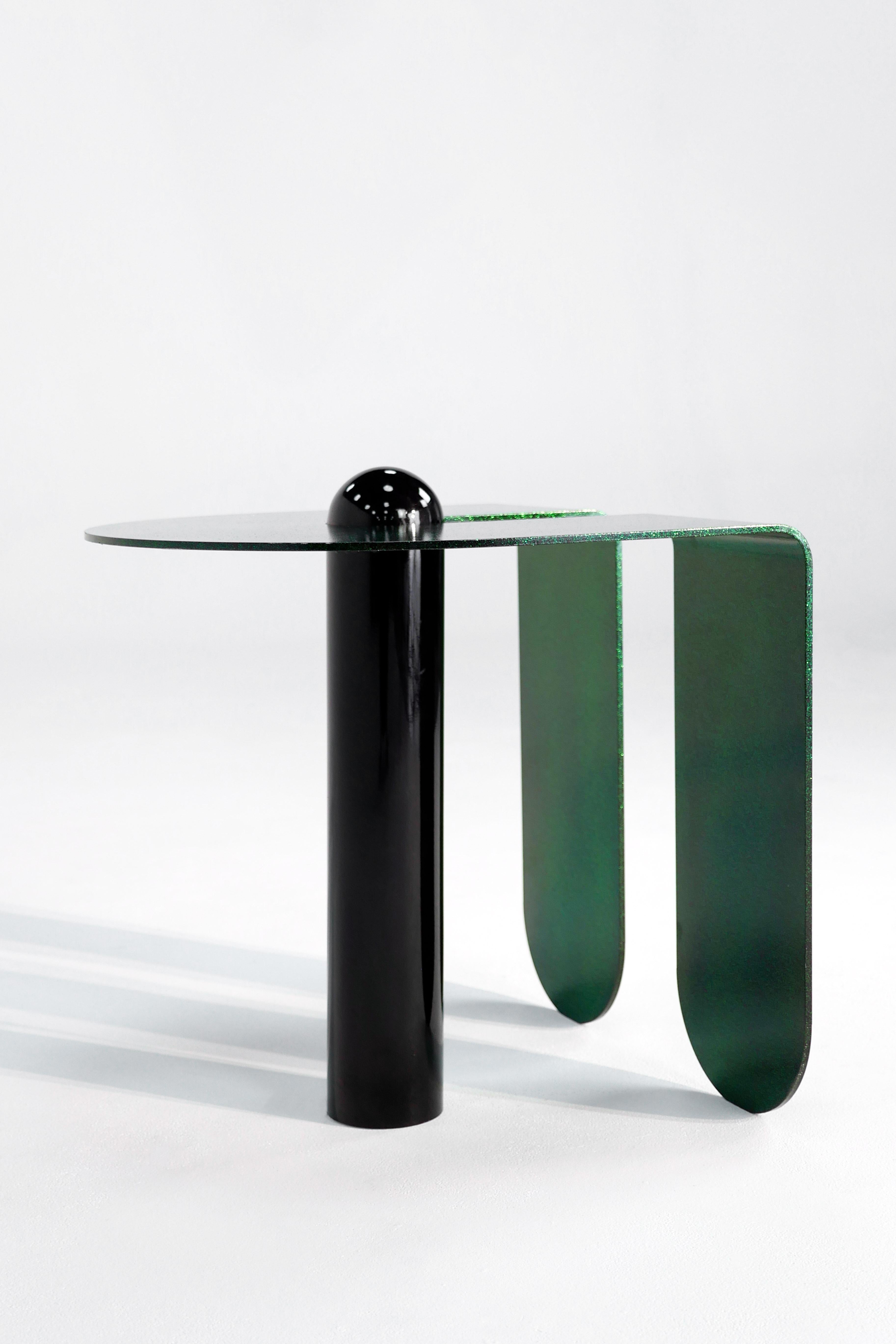 Juxtaposing highly distilled forms with sensuous curves, the U & I side table is both playful and elegantly simple. Powder-coated in a sparkling, three-dimensional candied glaze. 

Custom colors available upon request.