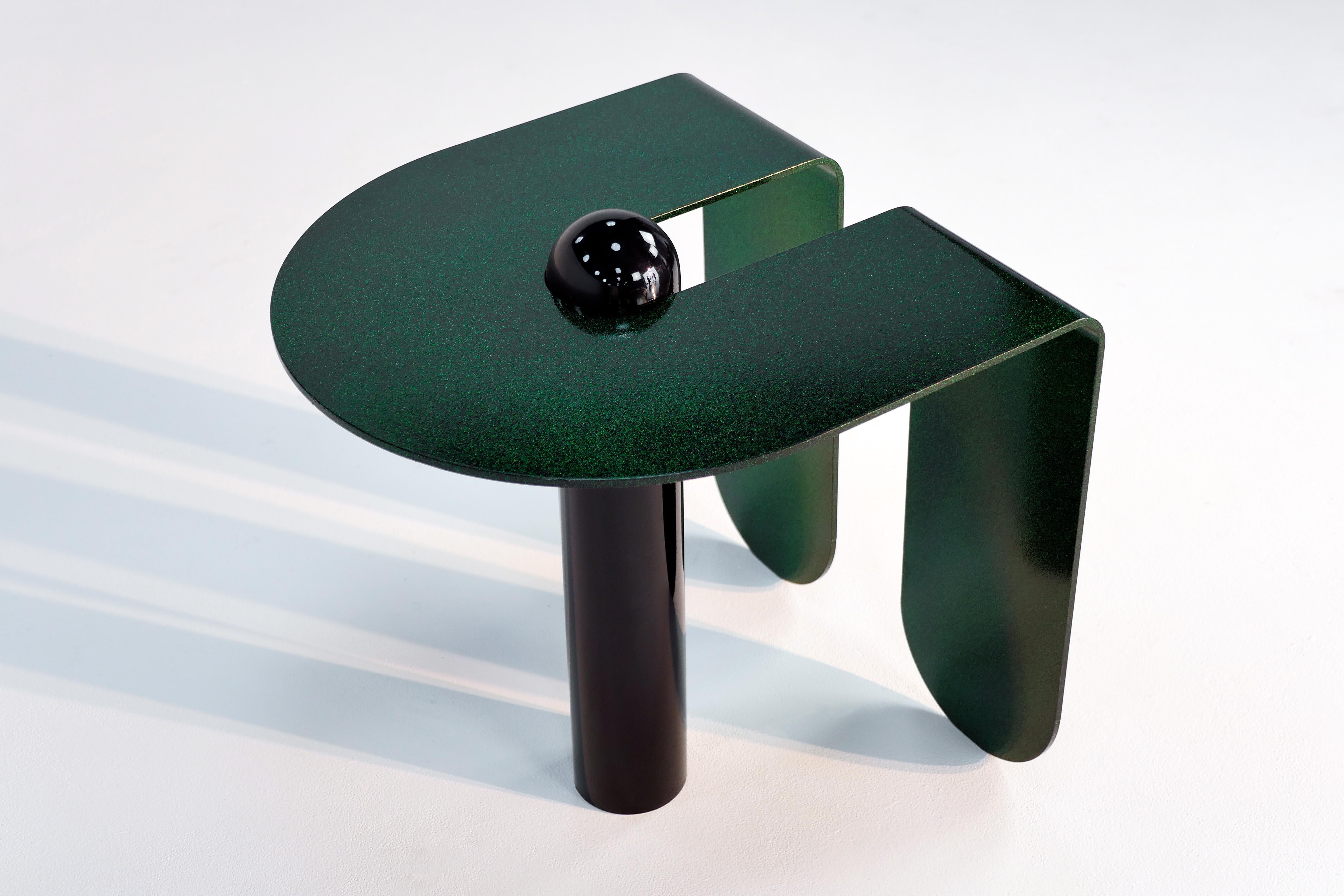 Juxtaposing highly distilled forms with sensuous curves, the U & I side table is both playful and restrained. Powder-coated with a sparkling, three-dimensional candied glaze.

Most custom colors available upon request. This listing is for a