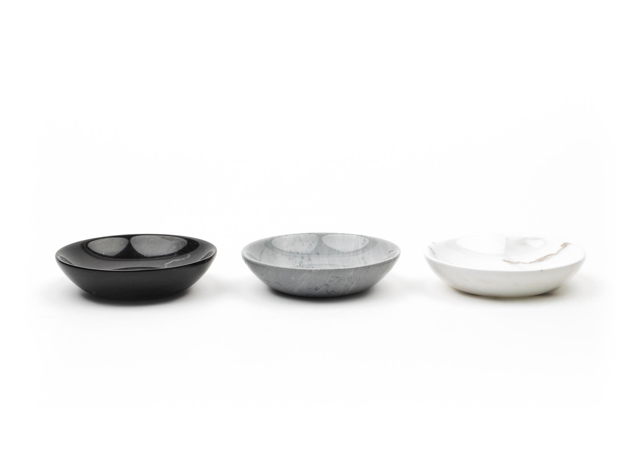 Set of three small dishes in grey Bardiglio, white Carrara and black Marquina marble. Size of each piece: diameter 13 cm x h 3. 
Ideal for serving salt, pepper and spices in a elegant, way, certificated for food use. Functional and ideal also for