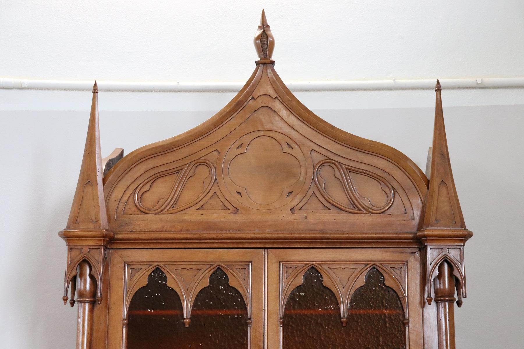 Impressive antique 19th century French Gothic style bookcase or sideboard:
Made entirely of carved walnut wood. The carving work is spectacular made by a great master of wood. We ask you to look at each image in detail to understand the importance