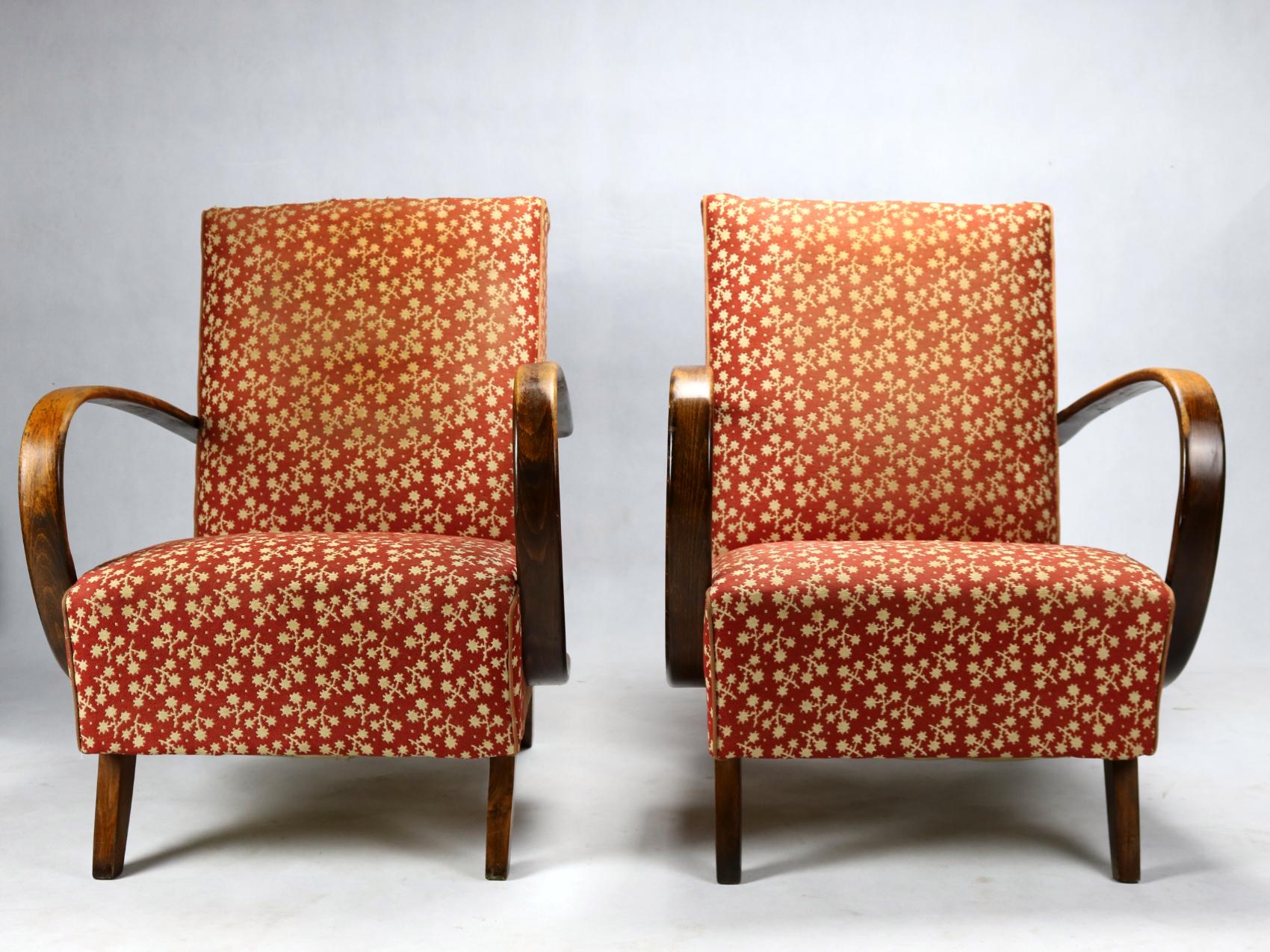 This lounge chairs, model No. 2, were designed by Jindrich Halabala and produced in former Czechoslovakia in the 1930s by UP Zavody Brno. The chairs features curved armrests and legs made from stained beech and are upholstered in original fabric.