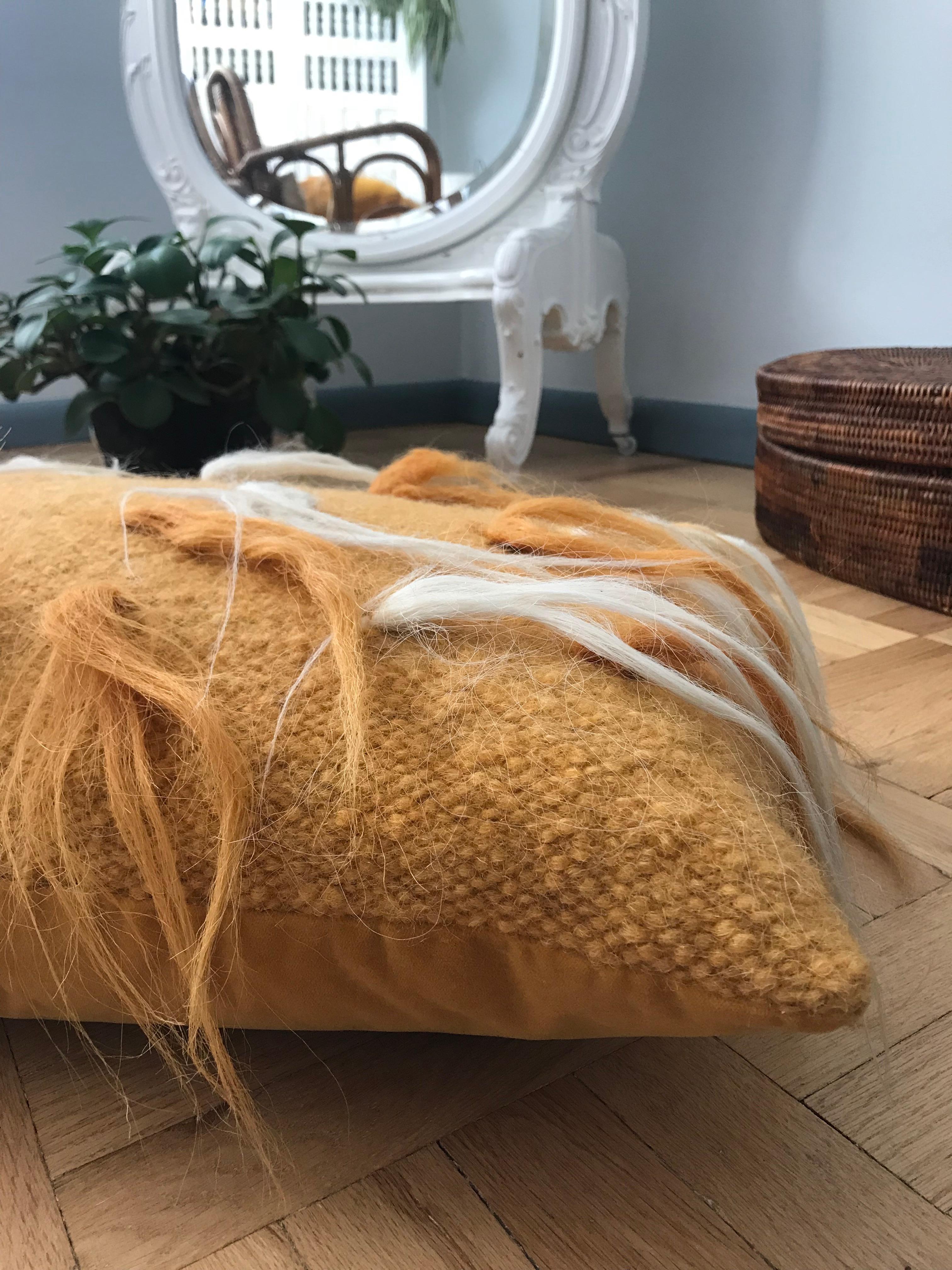 Handwoven and seasonally felted wool from long haired sheep in Europe, finished with plush velvet backing. While the weaving and felting methods date back hundreds of years, the design and contrasting colors bring this traditional weaving into the