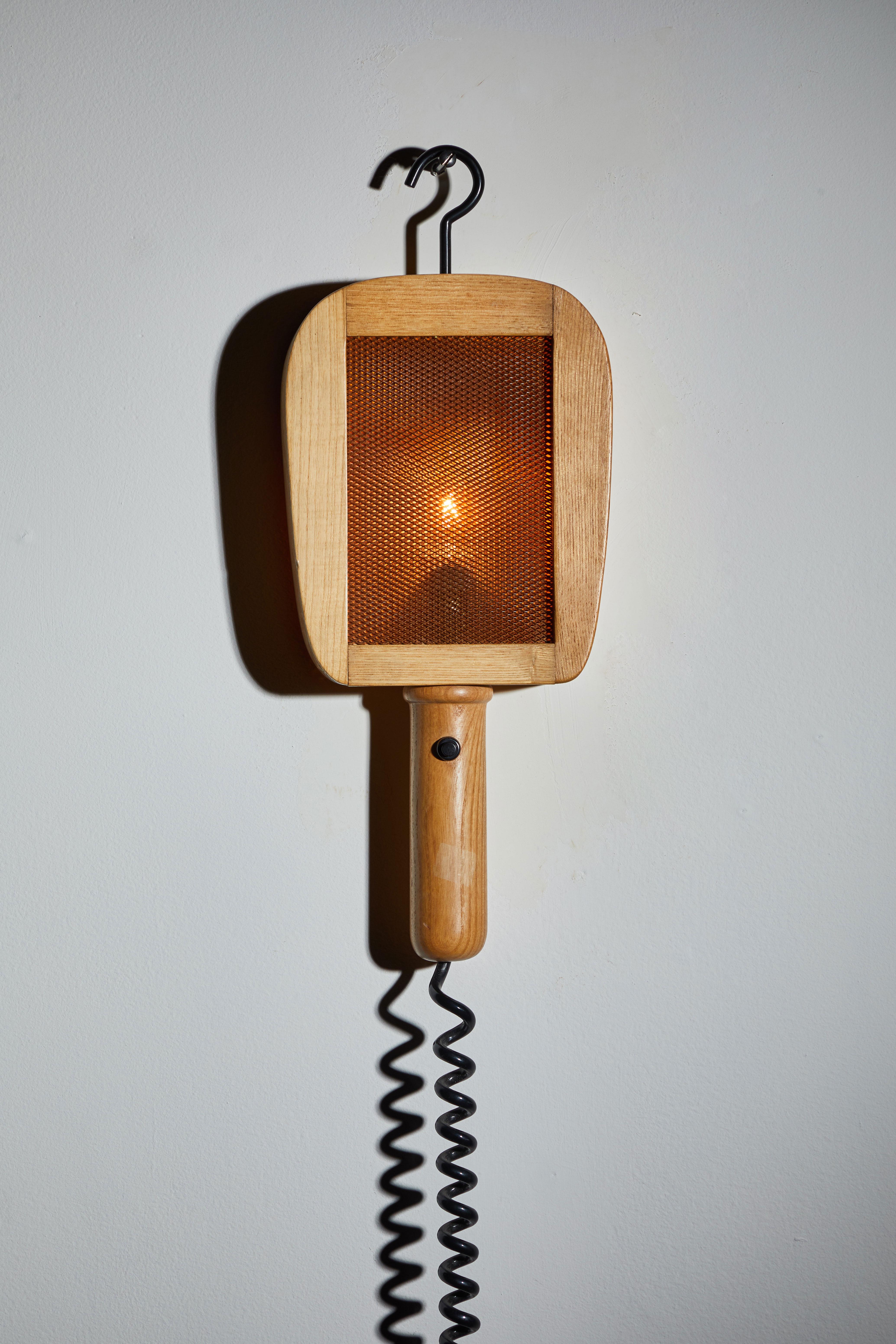 Wall Light by G. Bartolucci. Designed and manufactured in Italy, circa 1970s. Wood, metal wire, vinyl cord. Takes one E17 European candelabra. Plugs into wall. Retains original makers mark.