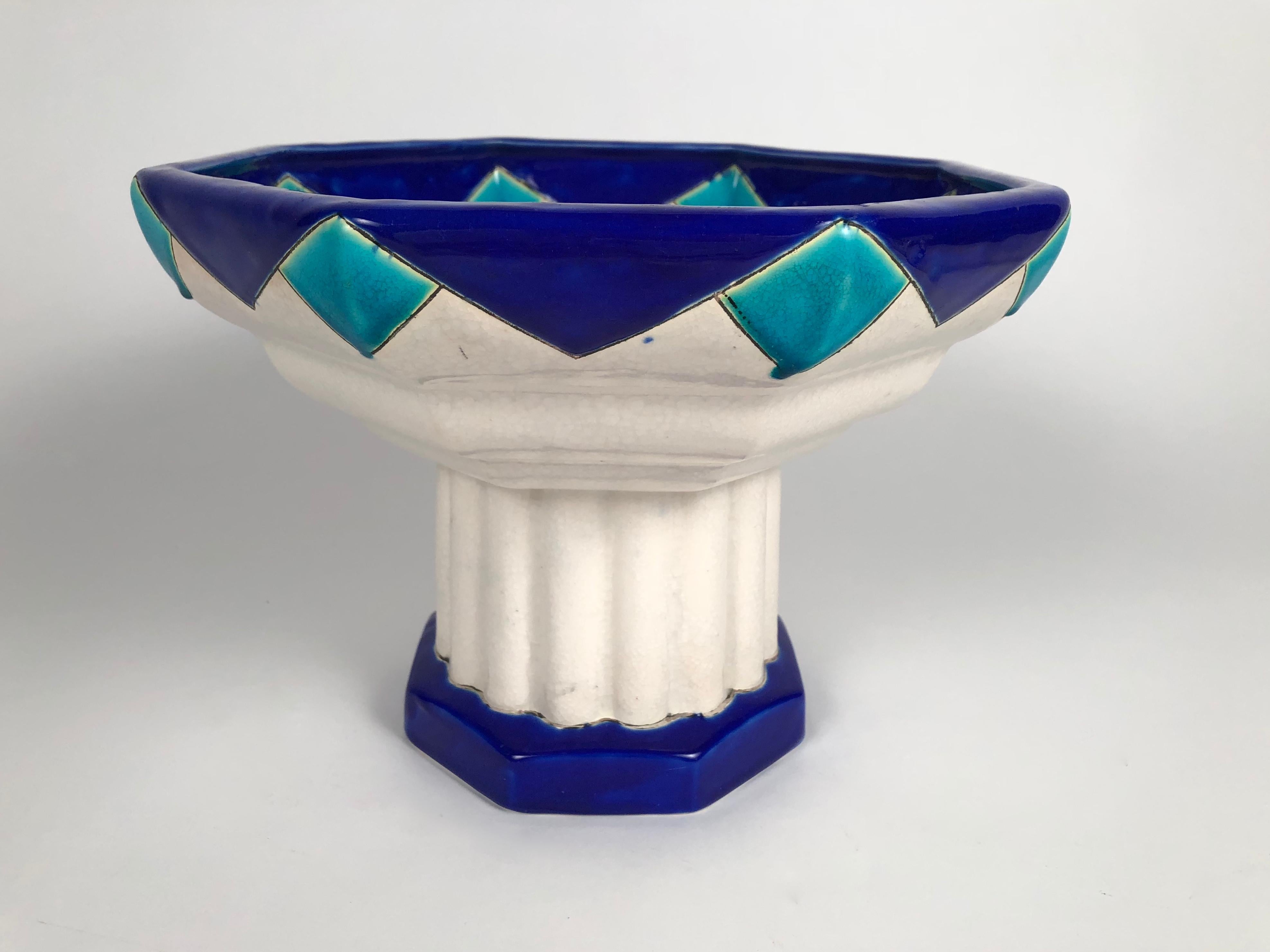 An Art Deco period ceramic footed octagonal compote, or footed bowl, by Boch Frères in blue and turquoise enamels. Signed and numbered on base, Belgian, circa 1930s. Perfect for use as a centerpiece on its own or with fruit or flowers.

Measures: