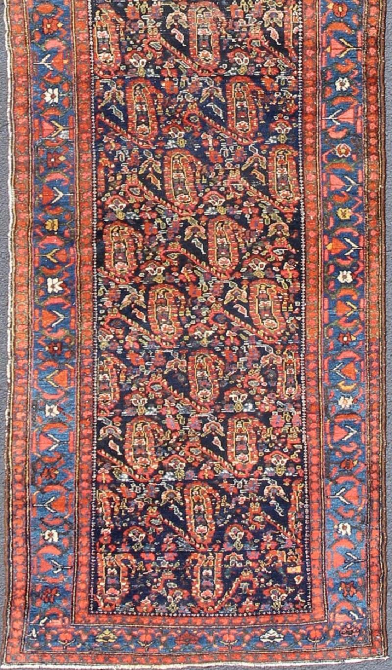 All-over sub-geometric design antique Persian Malayer runner in shades of blue and burnt orange, rug 18-0703, country of origin / type: Iran / Malayer, circa 1900.

This magnificent antique Persian Malayer runner (circa 1900) bears a beautiful,