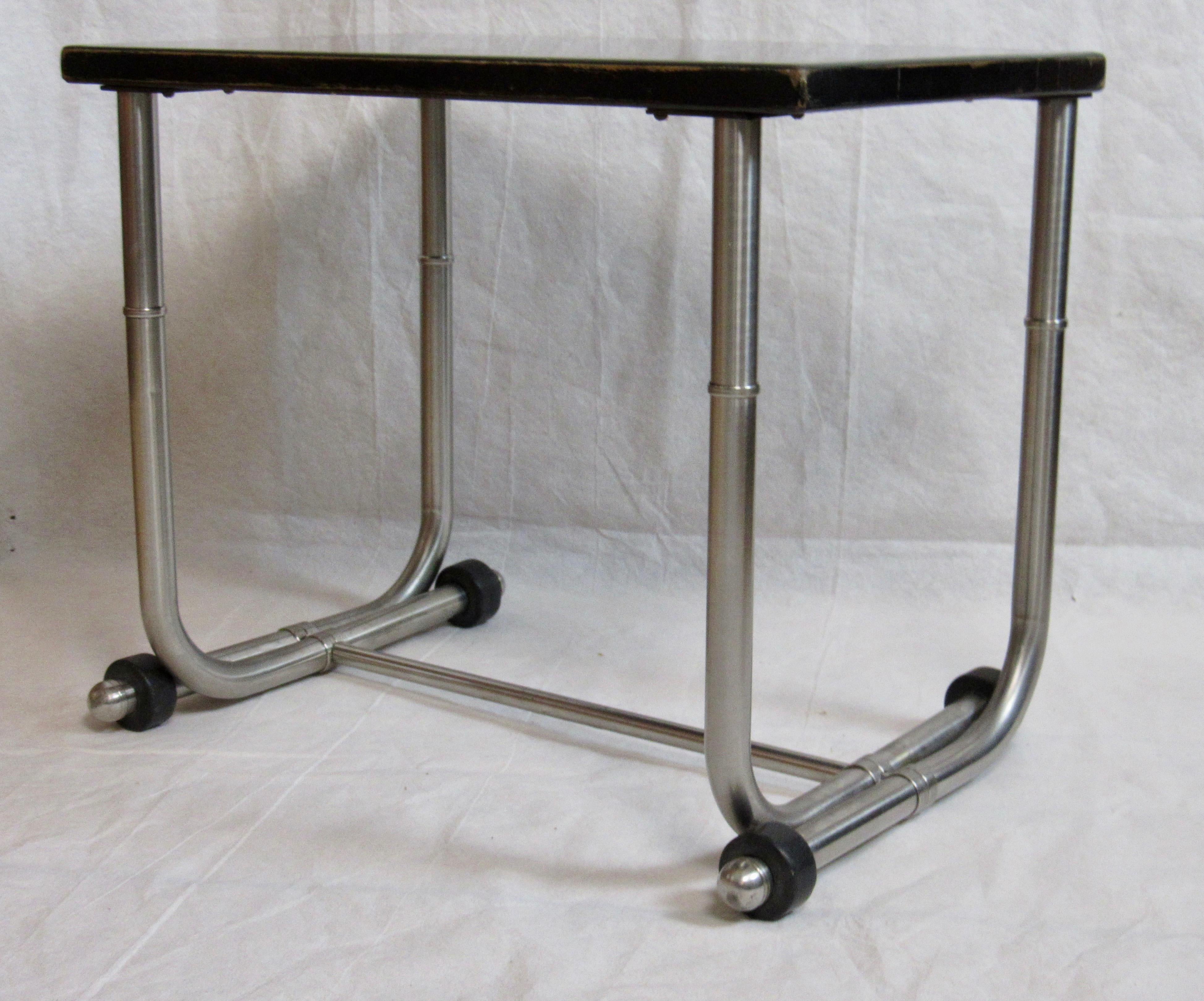 Unique example of a side table by Warren McArthur part of a group of furniture commissioned in stainless steel by Union Carbide for the terrace of a summer home in Glen Cove N.Y.. 

This table's design can be found on page 50 of the 1936 Warren