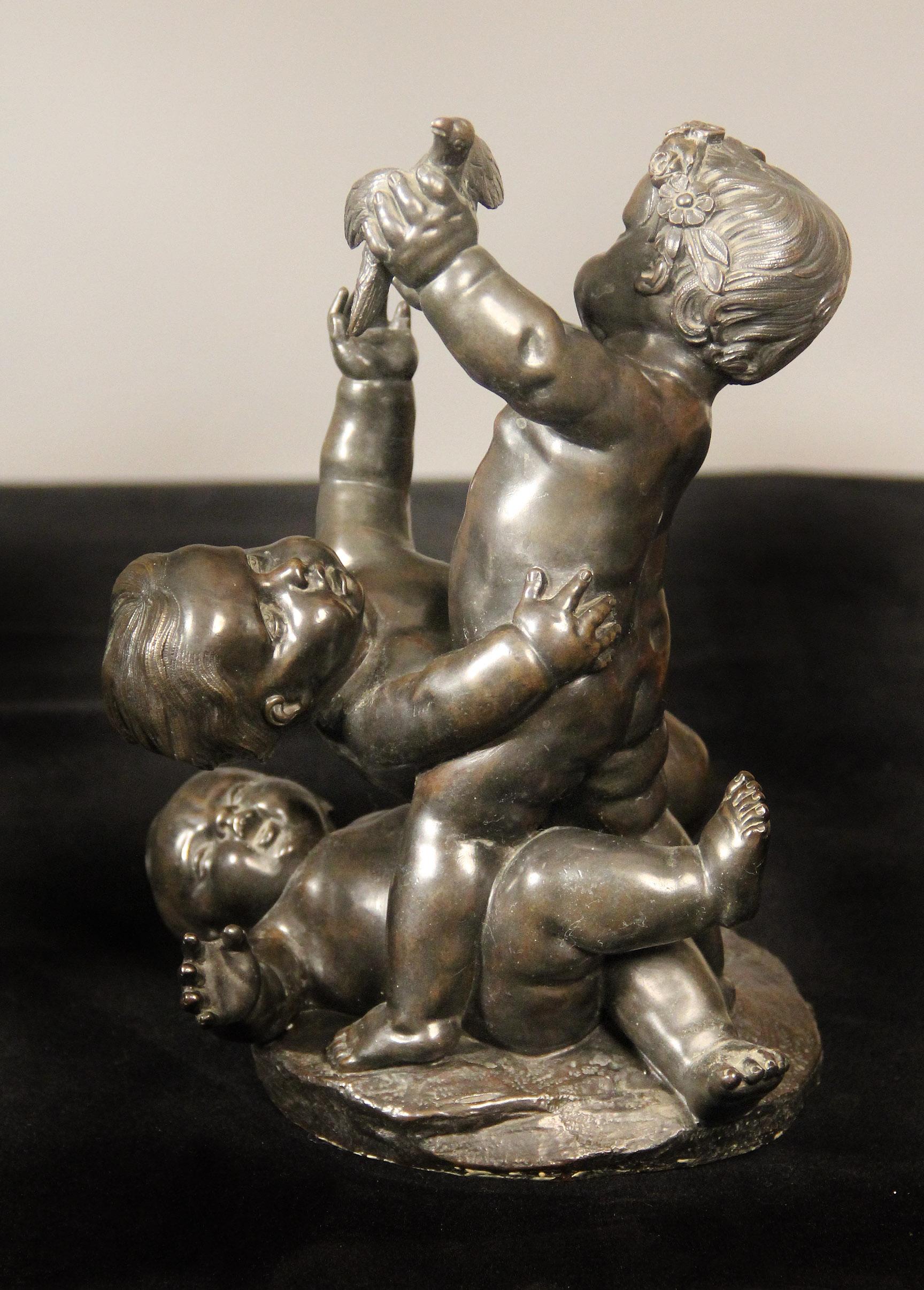 A lovely pair of late 19th century bronzes of putti at play

Each bronze depicting three putti wrestling around, one with a bird, the other with a conch.