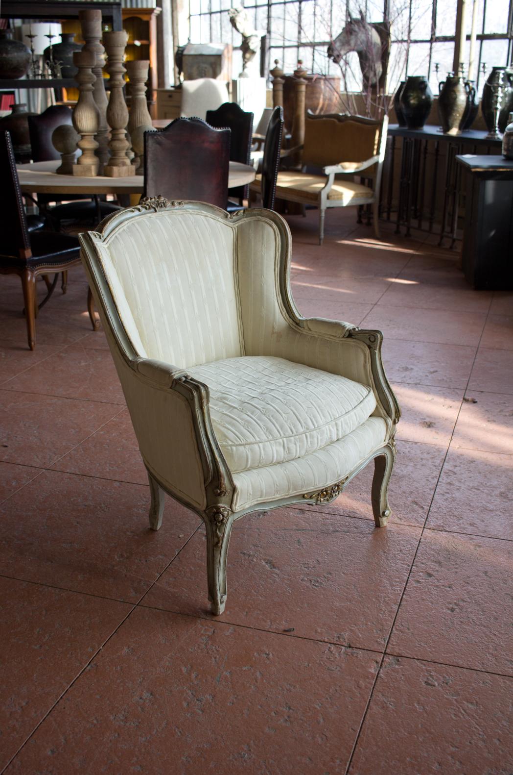 Antique Louis XV style bergère chair with beautiful old carvings and paint.