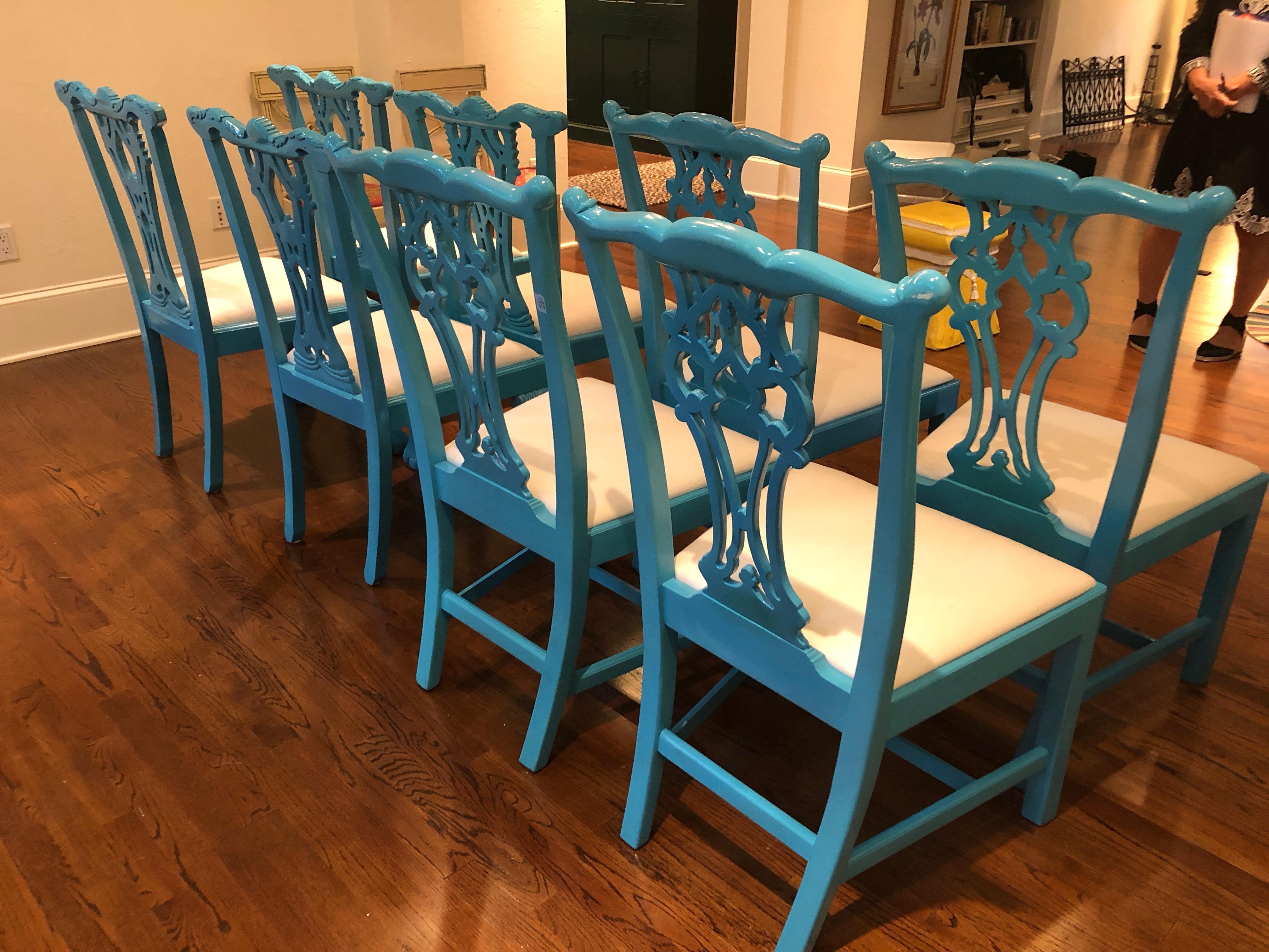A set of 8 super stylish elaborately carved wood dining side chairs, having glossy turquoise lacquer and upholstered seats. Upon close inspection, it's actually two sets of 4, adding to the visual play and interest.
Measures: Seat height 19, seat