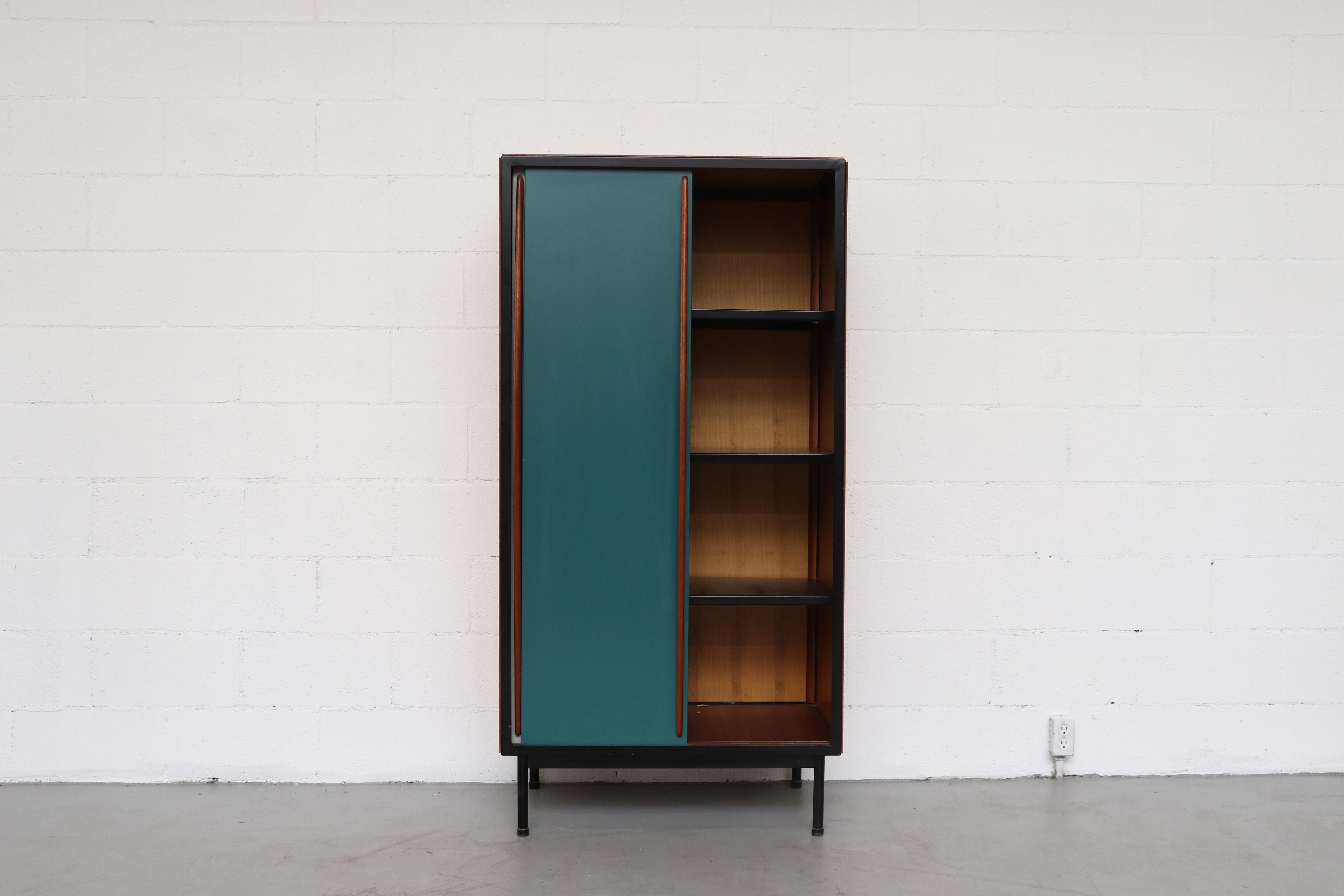Willy Van Der Meeren large wardrobe for Tubax with wood paneled sides, tapered mahogany door pulls and teal and grey enameled metal doors with black enameled metal frame, Belgium, 1952. Visible wear, consistent with its age and usage.