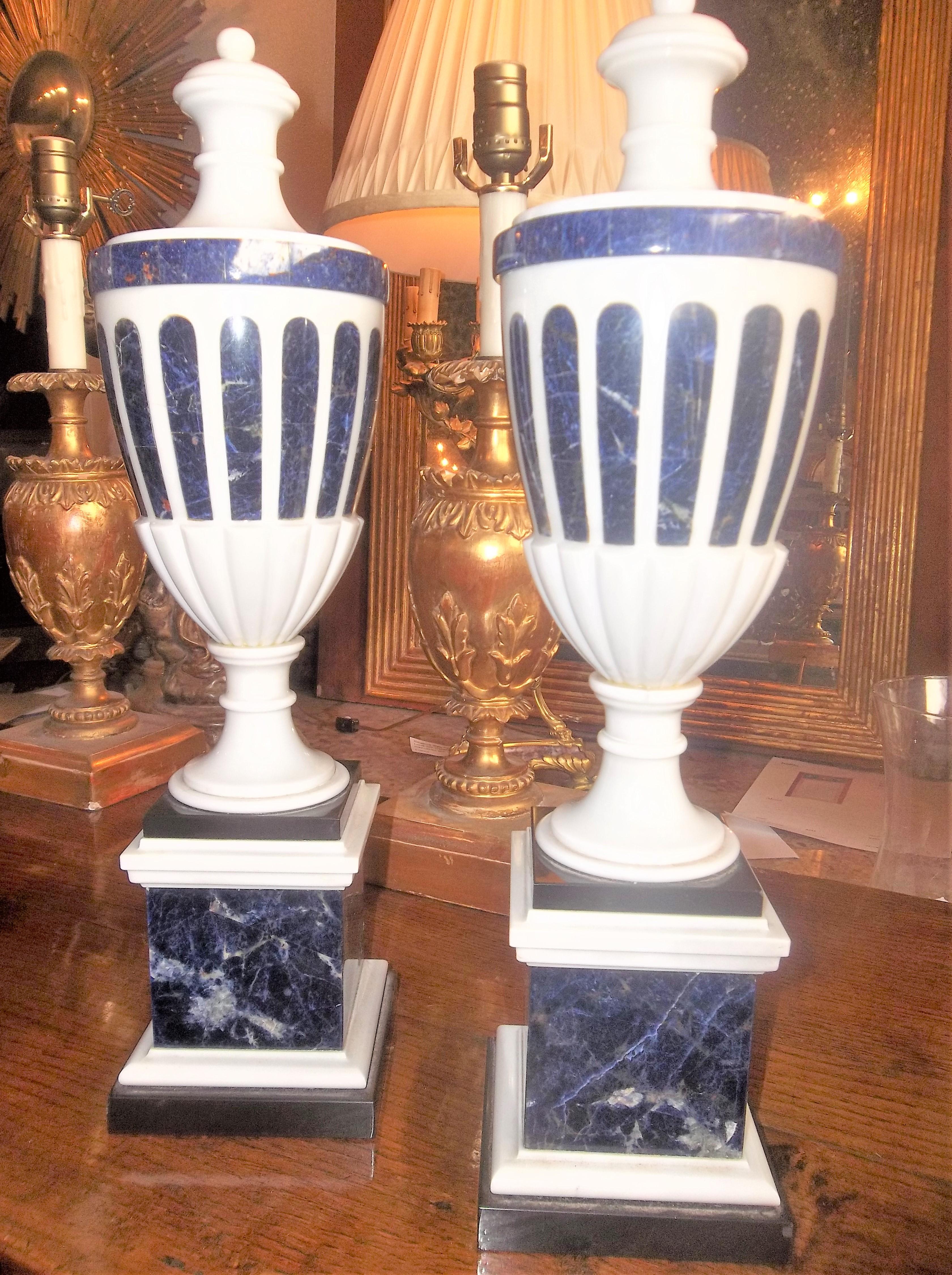 A  tall pair of cassolette garnitures or reversible into candlesticks on raised pedestals . Lapis inlaid into polished white marble or alabaster .The lapis with gold pyrite and white calcite veining.

Unmarked but best guess is France or Italy 

In