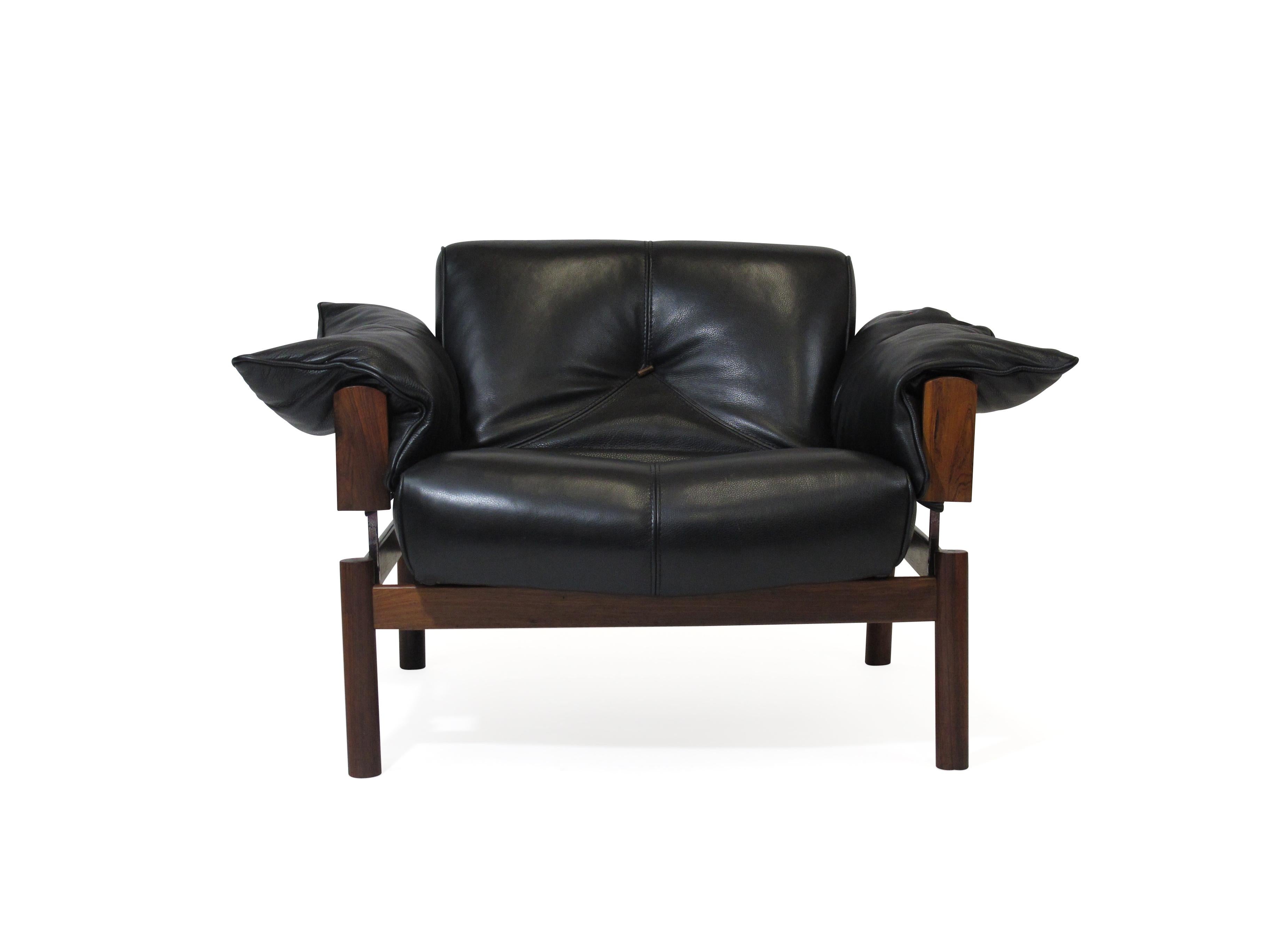 Brazilian modernist sofa and chair designed by Percival Lafer. Model MP-101, 103 is Lafer’s first sofa design created in 1960. The sofa and chair feature a stunning Brazilian rosewood structure with chrome supports. The sofa and chair has been newly