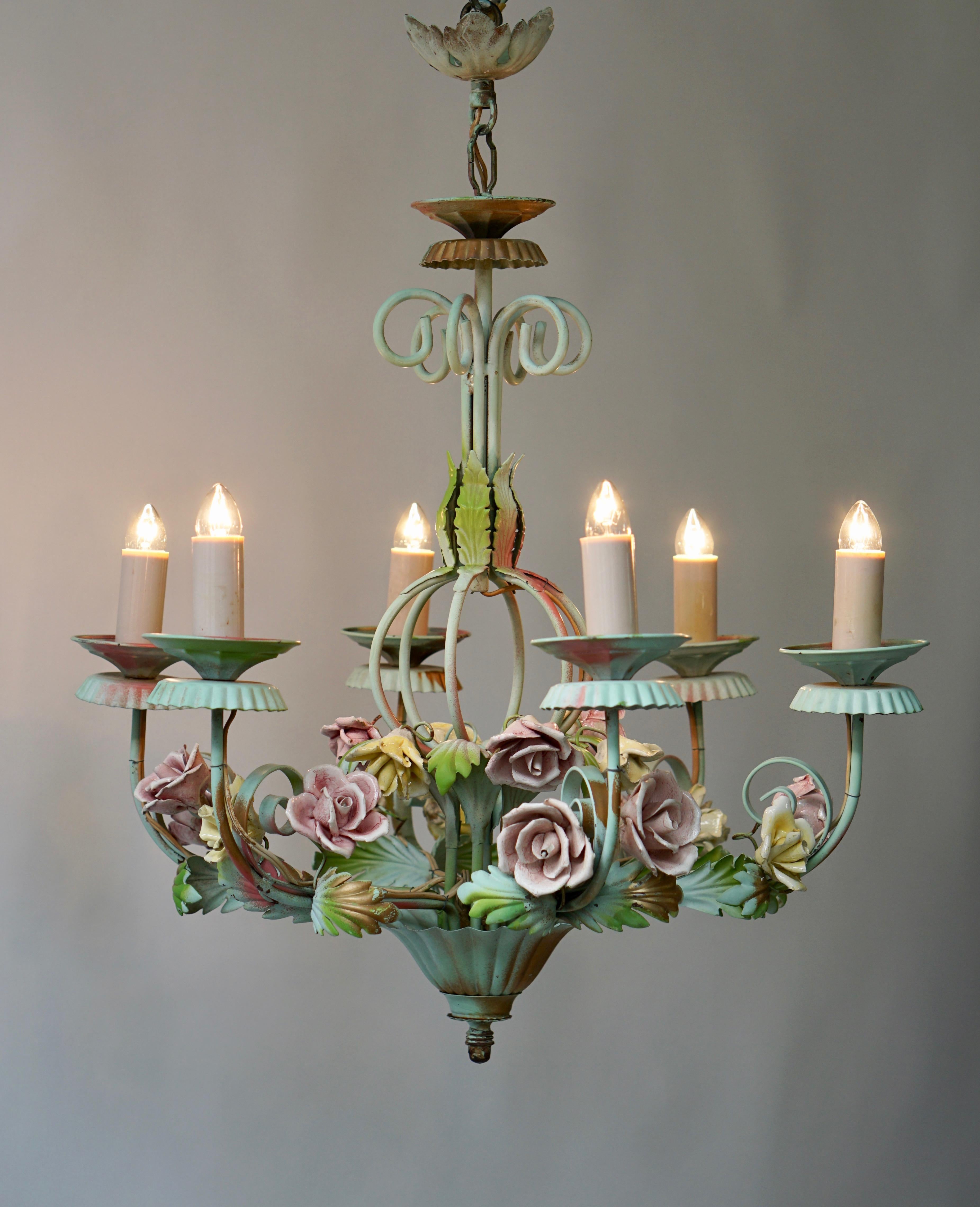 A painted Italian six-light tole flower chandelier.
The charming piece will add a touch of freshness to whatever room you place it in.
  