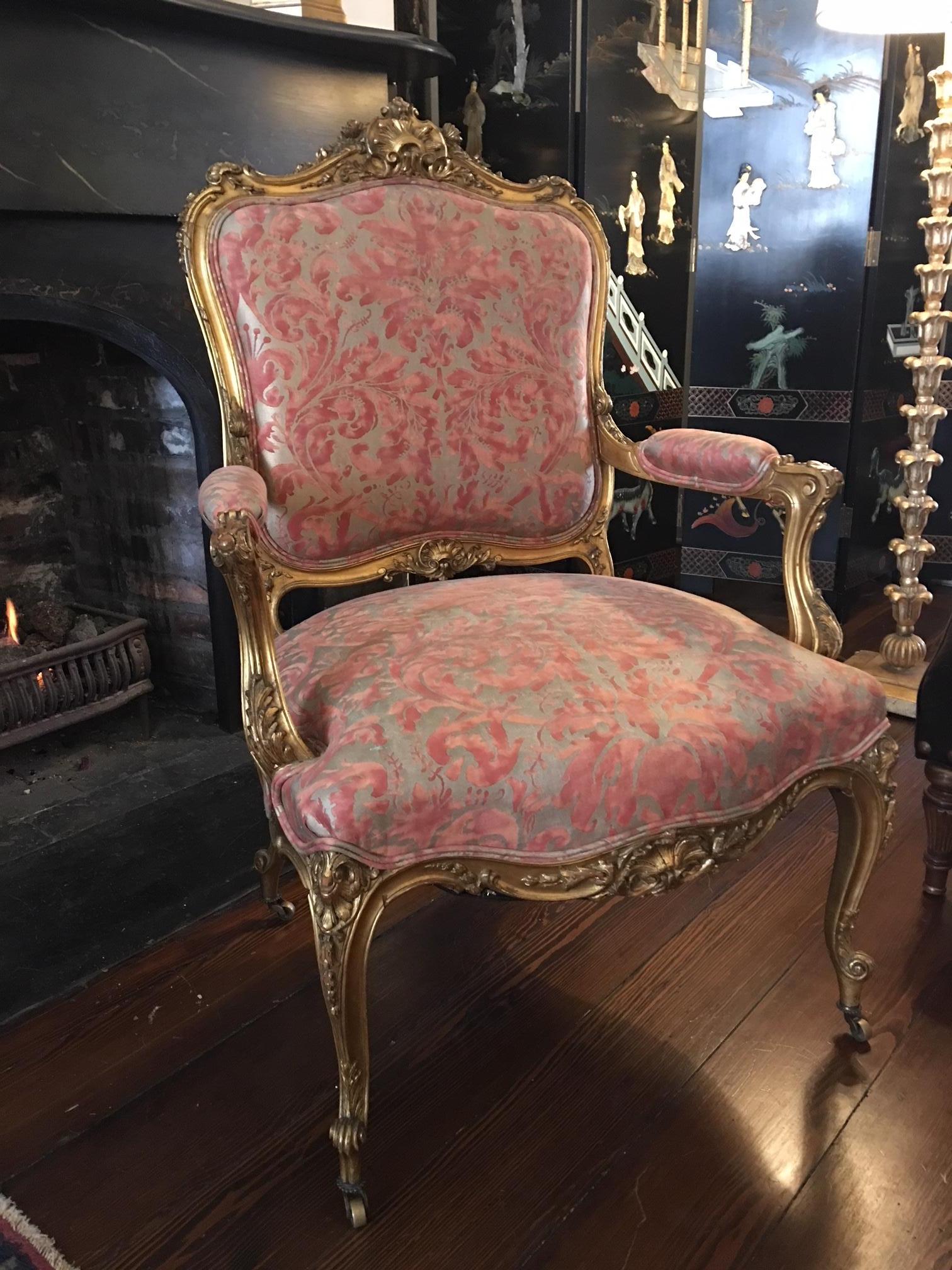 Louis XV style gilded fauteuil or armchair, 19th century. Fortuny fabric.