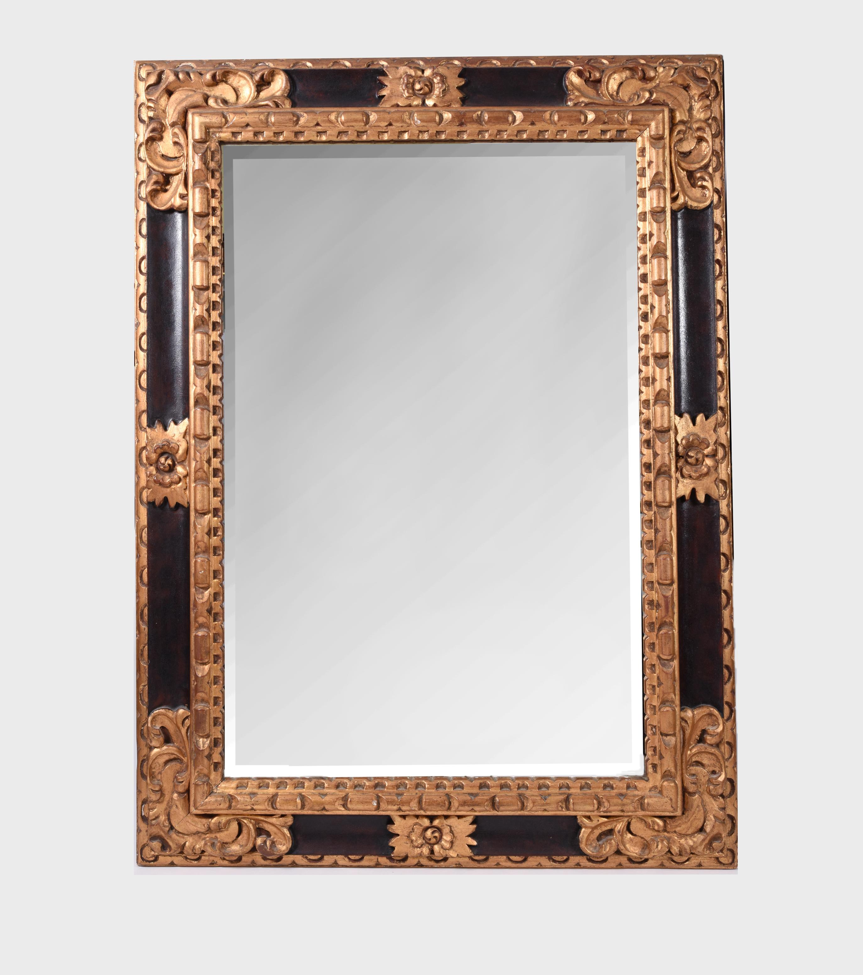 Mid-20th century giltwood framed design details hanging wall mirror. The hanging wall mirror measure about 45 inches length x 33 inches width.