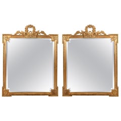 Early 20th Century Matching Pair of Giltwood Hanging Beveled Mirrors