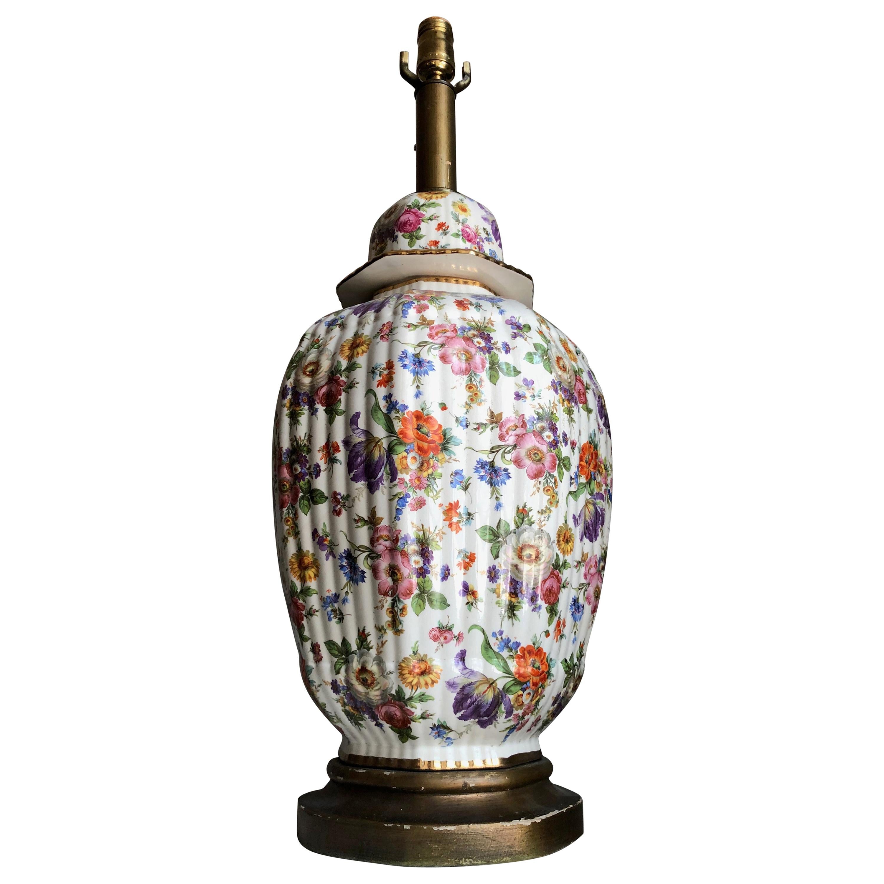 Gorgeous and monumental gilt hand painted floral Porcelain chinoiserie ginger jar wired as lamp. Lovely scale and proportions. Genius use of color.