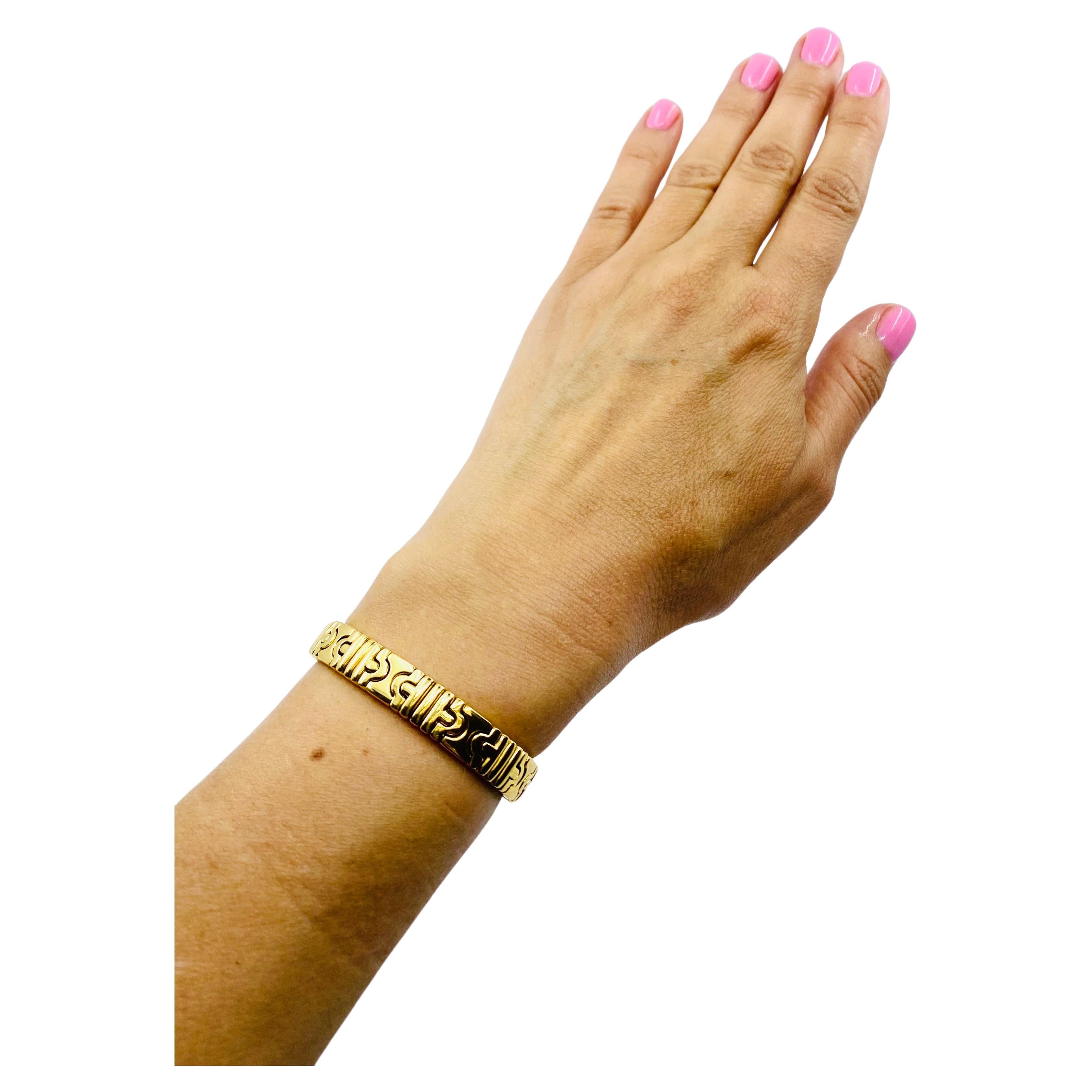 DESIGNER: Bulgari
CIRCA: 1990’s
MATERIALS: 18K Yellow Gold 
WEIGHT:  52.3 grams
MEASUREMENTS: 5.5” inner circumference x 5/16”
HALLMARKS: BVLGARI, 750


ITEM DETAILS:
 18k gold Bulgari Parentesi bangle bracelet. Bulgari’s created many varieties of
