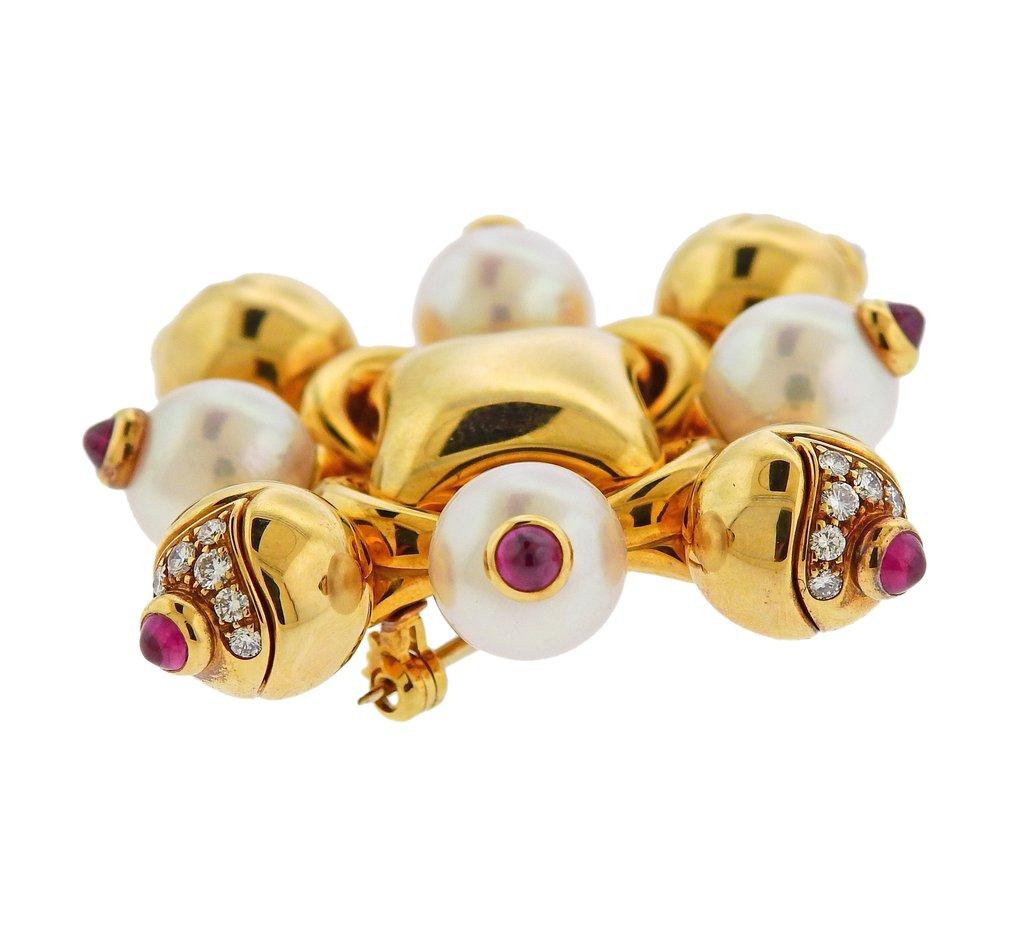 18k yellow gold brooch, designed by Bvlgari, set with rubies, pearls and approx. 0.40ctw in G/VS diamonds. Brooch is 48mm x 48mm. Weight is 29 grams. Marked Bulgari 750. 