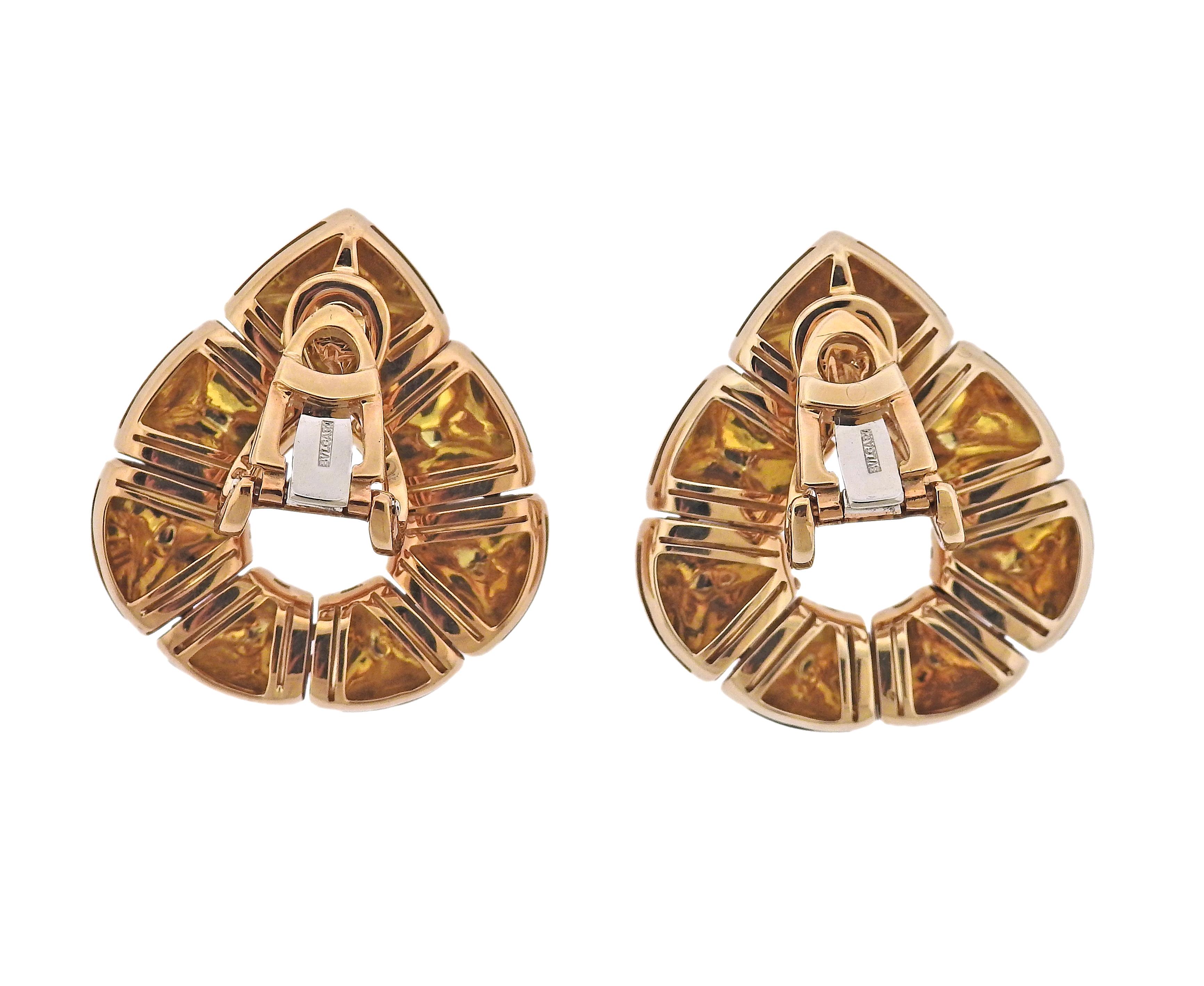 Bvlgari 18k yellow gold earrings. Come with Bvlgari box and a copy of Insurance Appraisal report from 1992. Earrings are 33mm x 30mm. Weight - 50.6 grams. Marked: BA 6418, Bvlgari, 750, 2337AL.