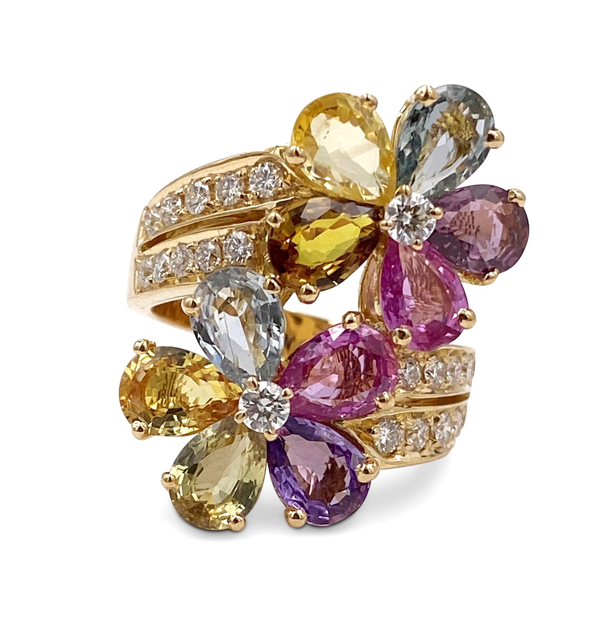 Authentic Bulgari ring crafted in 18 karat yellow gold with multi-colored sapphires and round brilliant diamonds. 10 pear-shaped sapphires create the petals of this beautiful floral design.  Round brilliant diamonds (F-G color, VS clarity) are at