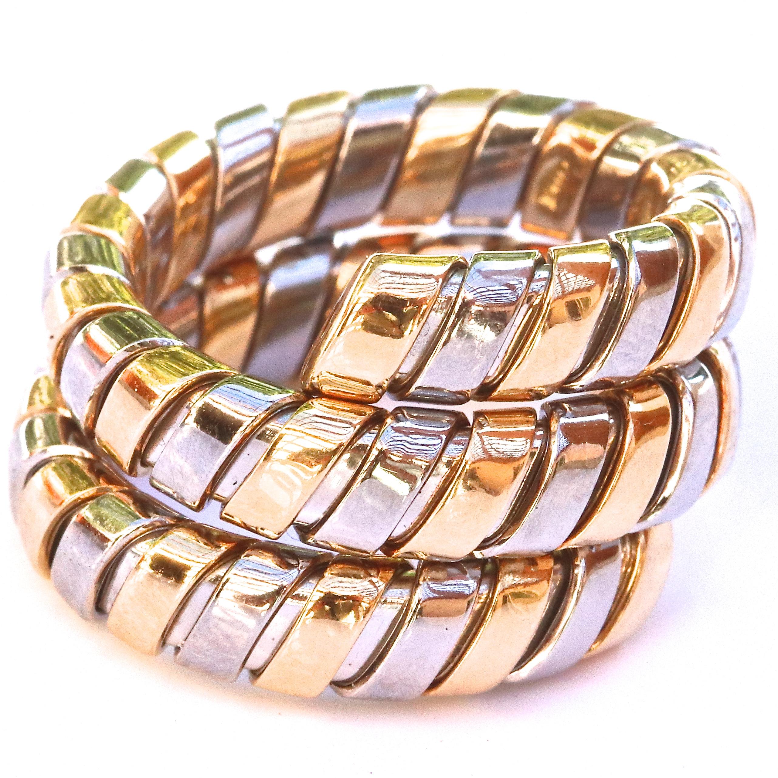 Bulgari 18k yellow gold & stainless steel tubogas ring. Signed Bvlgari and has italian hallmark. Circa 1990s. Size 6. Stamped 750. 
Jack Weir & Sons Flawless Protection Plan: 
7 day return policy for full cash refund
30 day return for store credit
