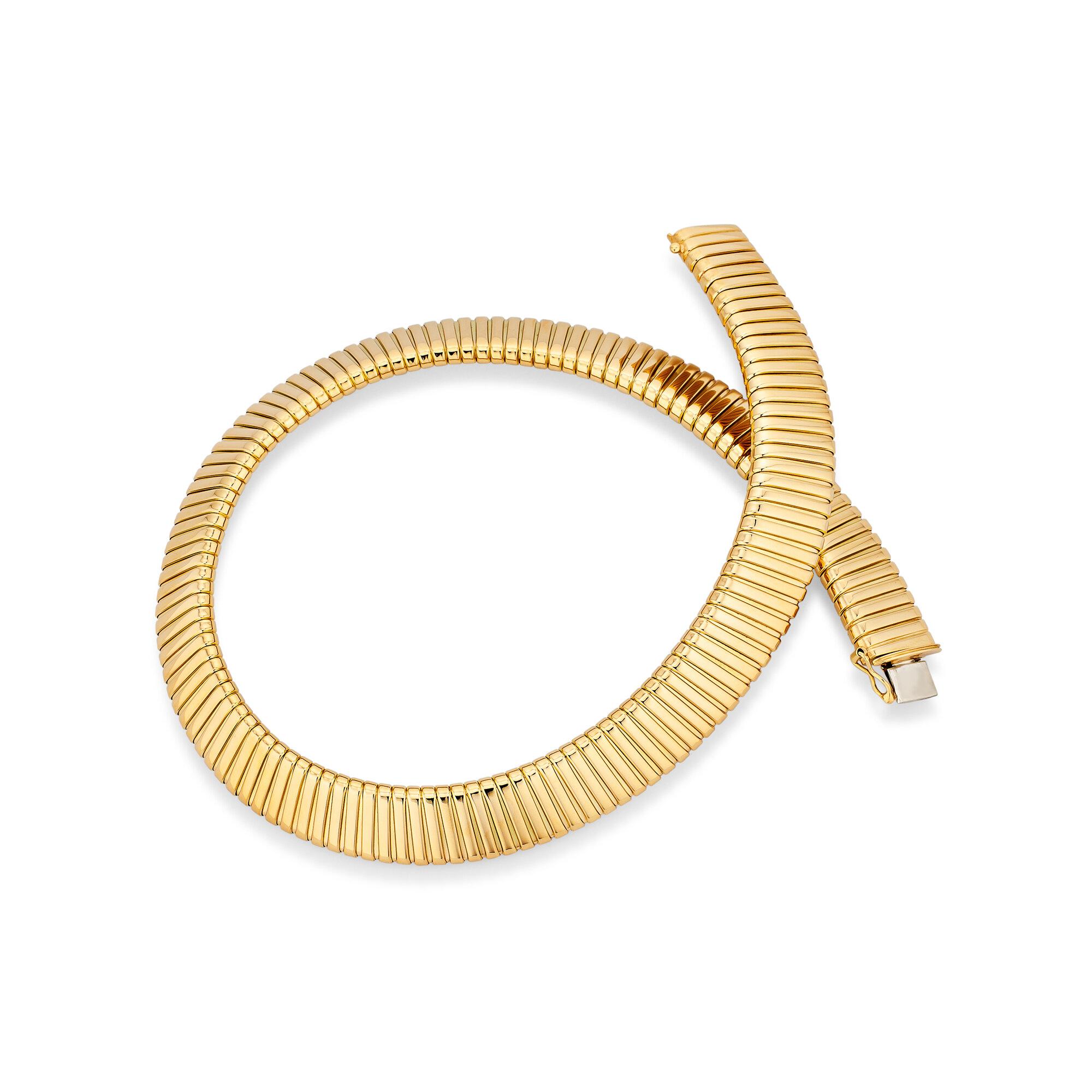 When only just the right amount of gold will do, this clean, sleek, and timeless Bulgari handmade tubogas necklace will fit the bill.  With a striking yet minimalist presence, this vintage 18 karat yellow gold necklace will quickly become your go-to