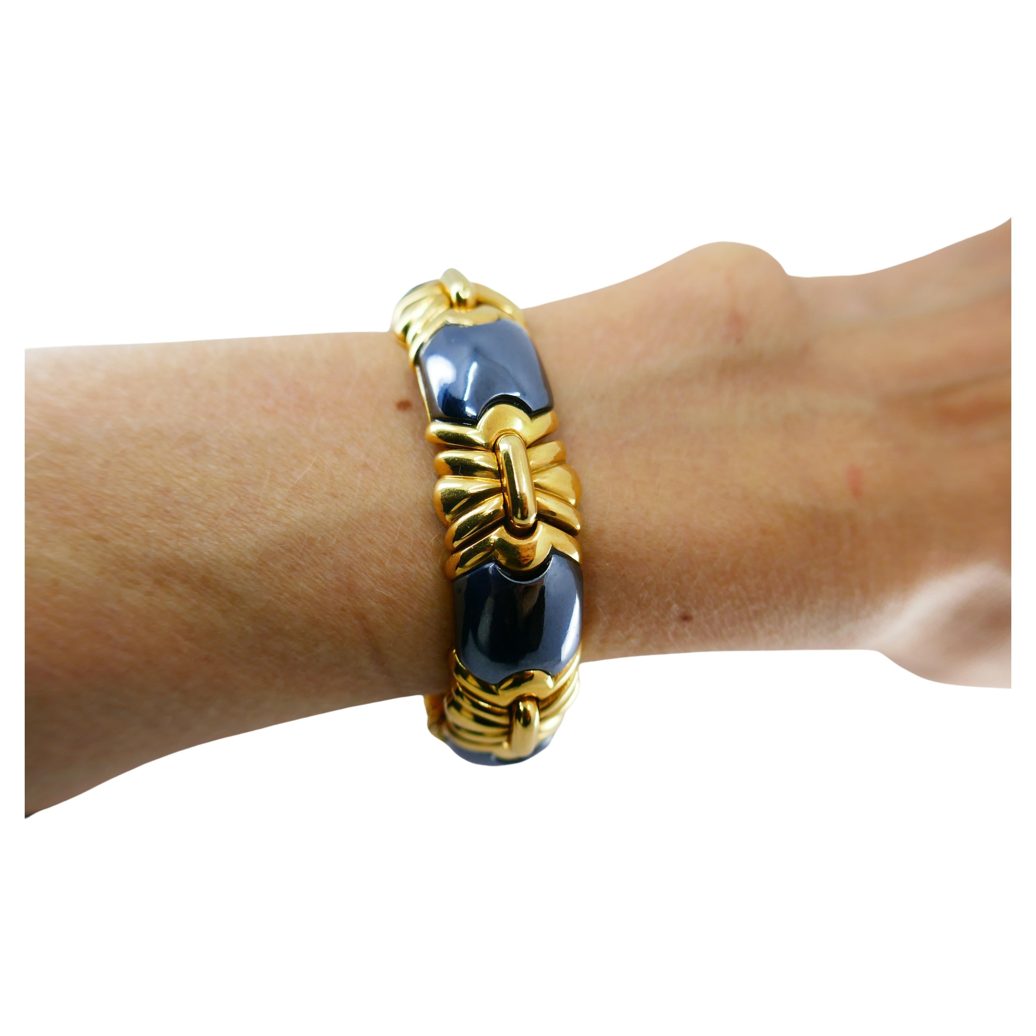 A stunning Bulgari bracelet made of 18k gold and hematite. The pattern is built out of the hi-polished gold elements alternated with geometrical hematite pieces. The latter are rather flat, and the gold 