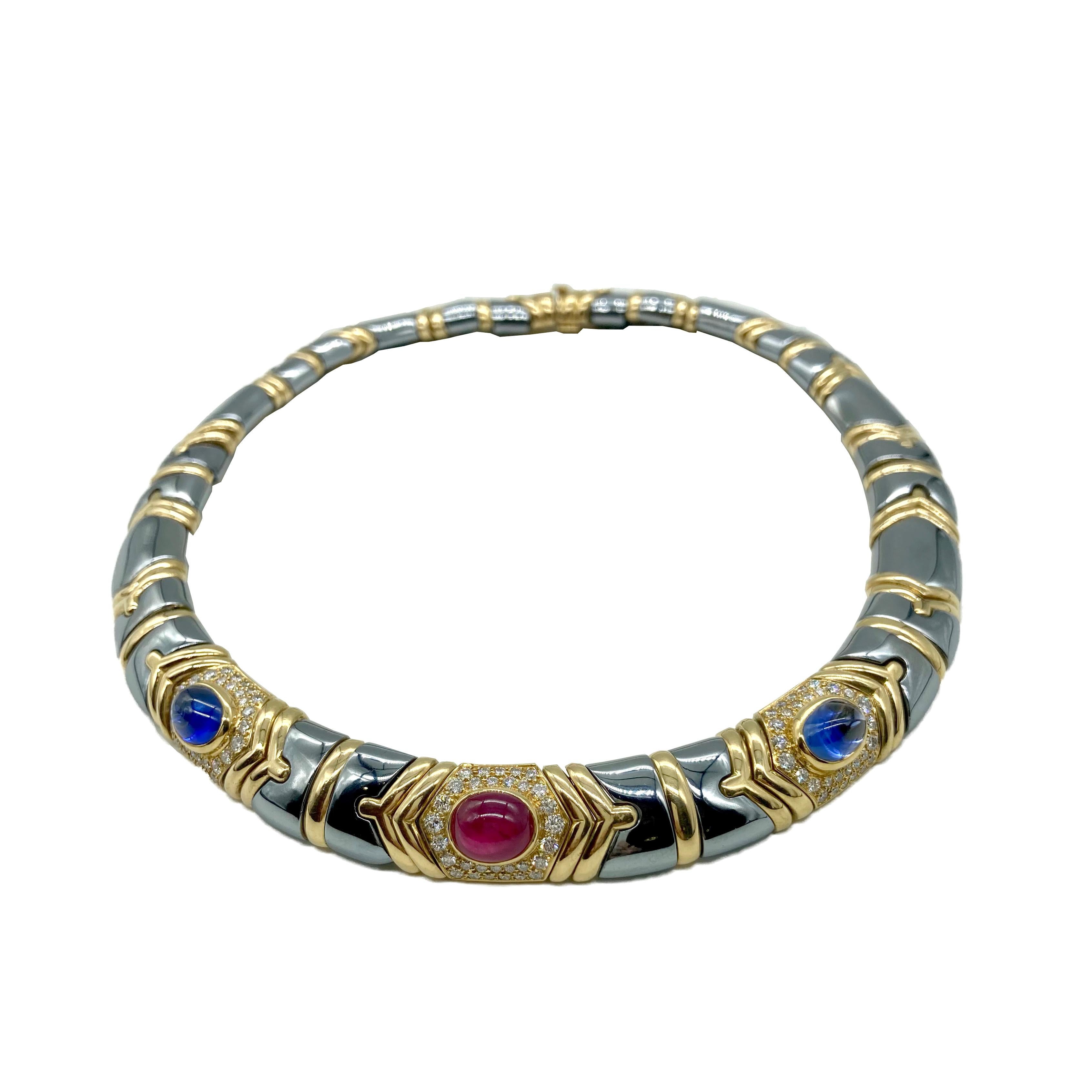 A chic Bulgari necklace in 18 karat yellow gold with hematite, diamonds, and cabochon ruby and sapphires. Made in Italy, circa 1985.