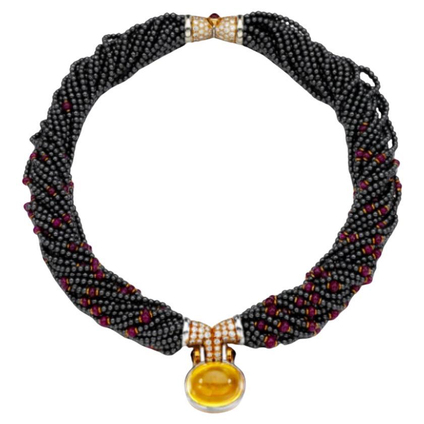Bulgari Hematite, Ruby and Diamond Torsade Necklace with a 43ct Yellow Sapphire