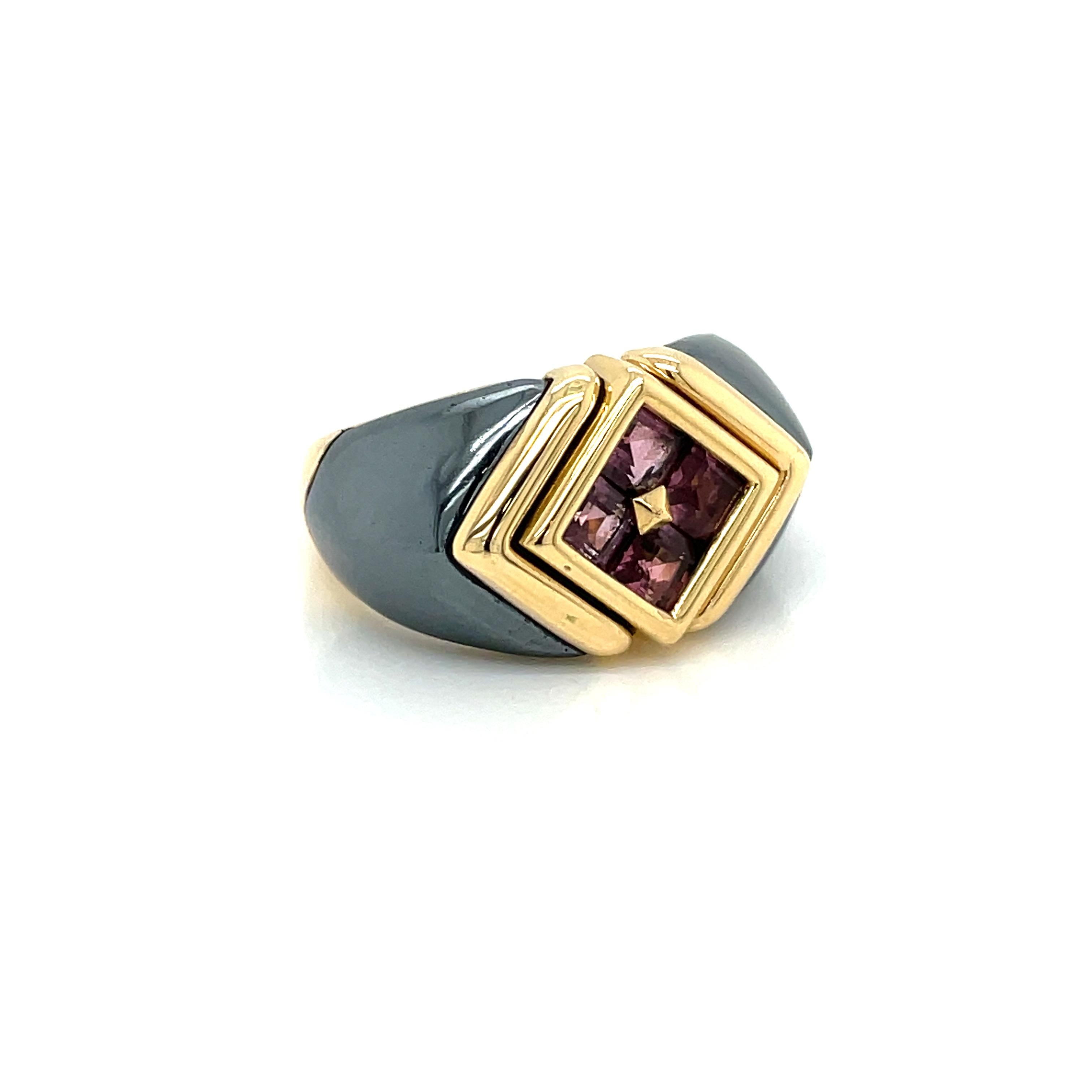 Timeless ring created by Bulgari in Italy in 1988. The set is made of 18 karat yellow Gold, Hematite and four square cut sparkling Tourmalines. 
Stamped BVLGARI, with the maker's mark, the Italian gold assay hallmark, numbered and dated 1988'.

The