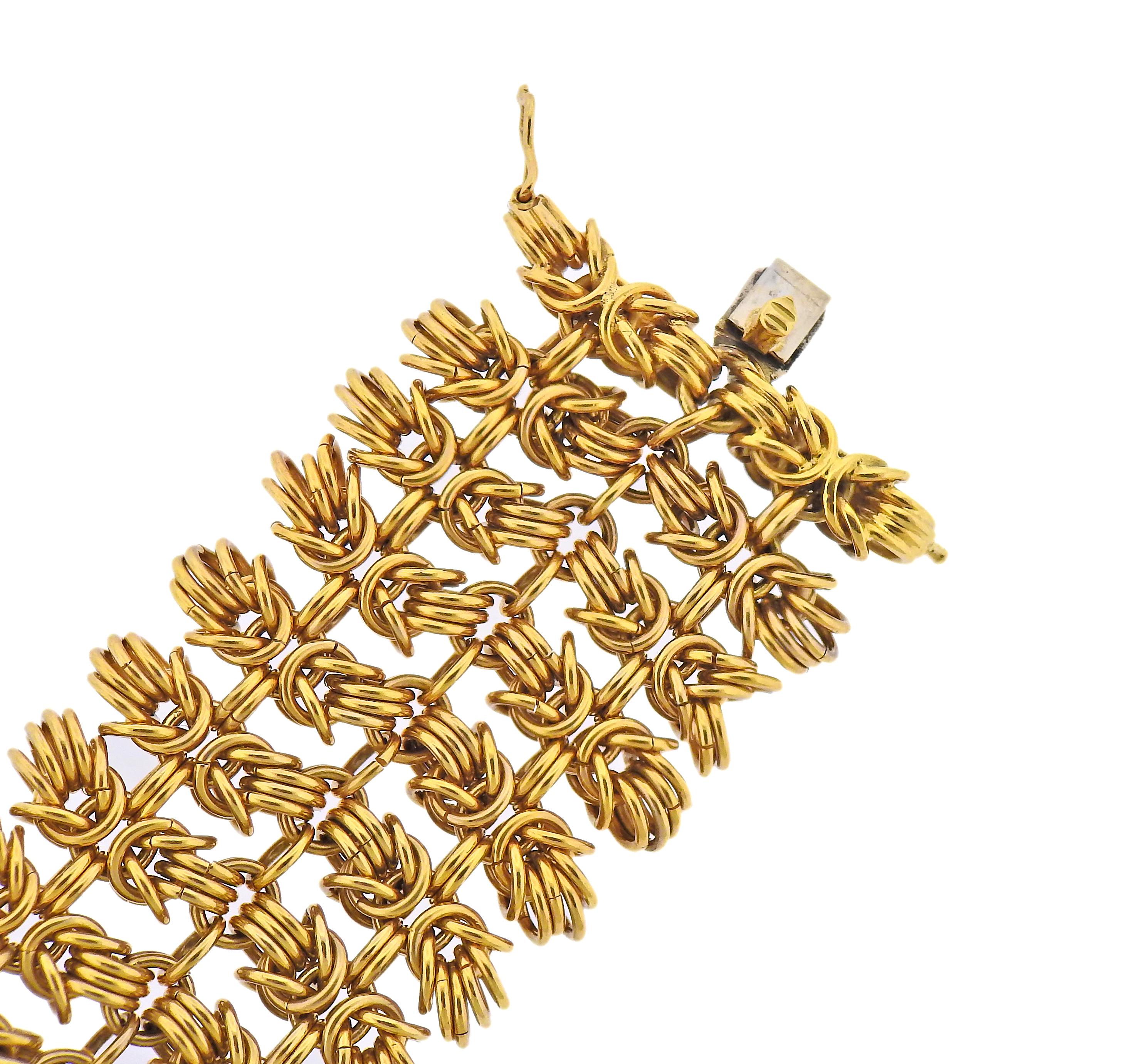 Vintage 18k gold bracelet by Bvlgari, featuring interlocked Hercules knot links. Bracelet is 7 5/8