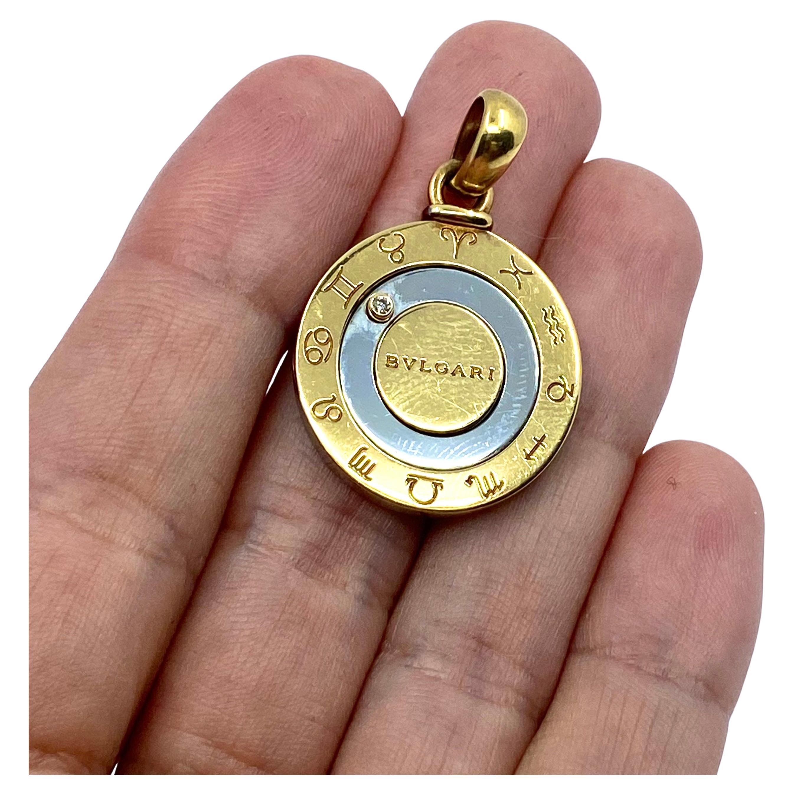 DESIGNER: Bulgari
CIRCA: 2000s
MATERIALS: 18k  Gold
GEMSTONE: Round Brilliant Cut Diamond
WEIGHT: 10.9 grams
MEASUREMENTS:  Diameter -  7/8”
HALLMARKS: Bvlgari, 750, Made in France, Steel and Gold

A Bulgari Horoscope charm pendant, made of 18k gold