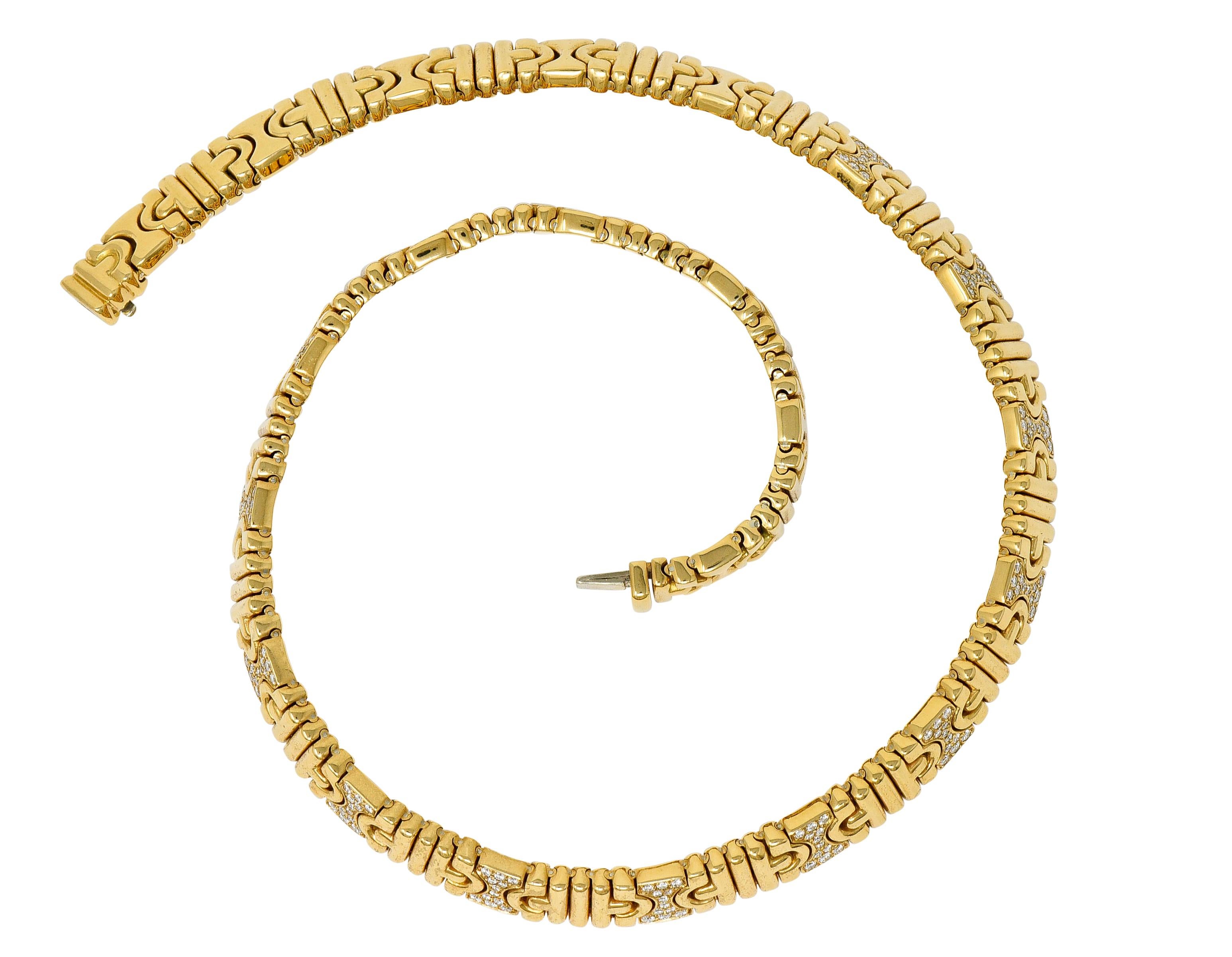 Collar style necklace comprised of hour glass and ribbed links that interlock in a flawless pattern

Accent links are pavè set with round brilliant cut diamonds weighing in total approximately 2.50 carats; G/H color with VS clarity

Completed by a