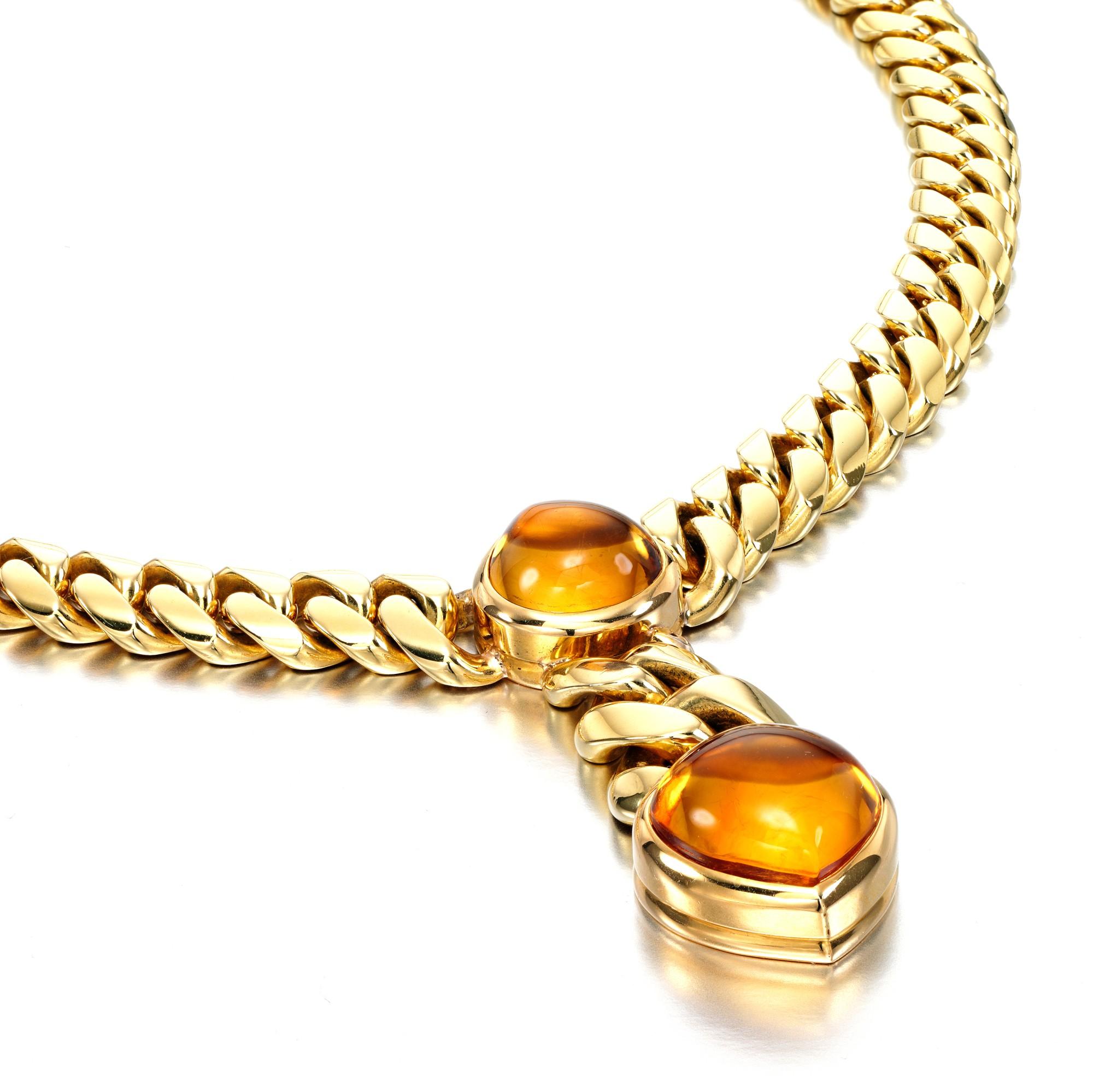 An iconic Bulgari necklace circa 1970s showcasing 2 cabochon citrines suspended by a curb style necklace. The necklace has a total weight of 112 grams.