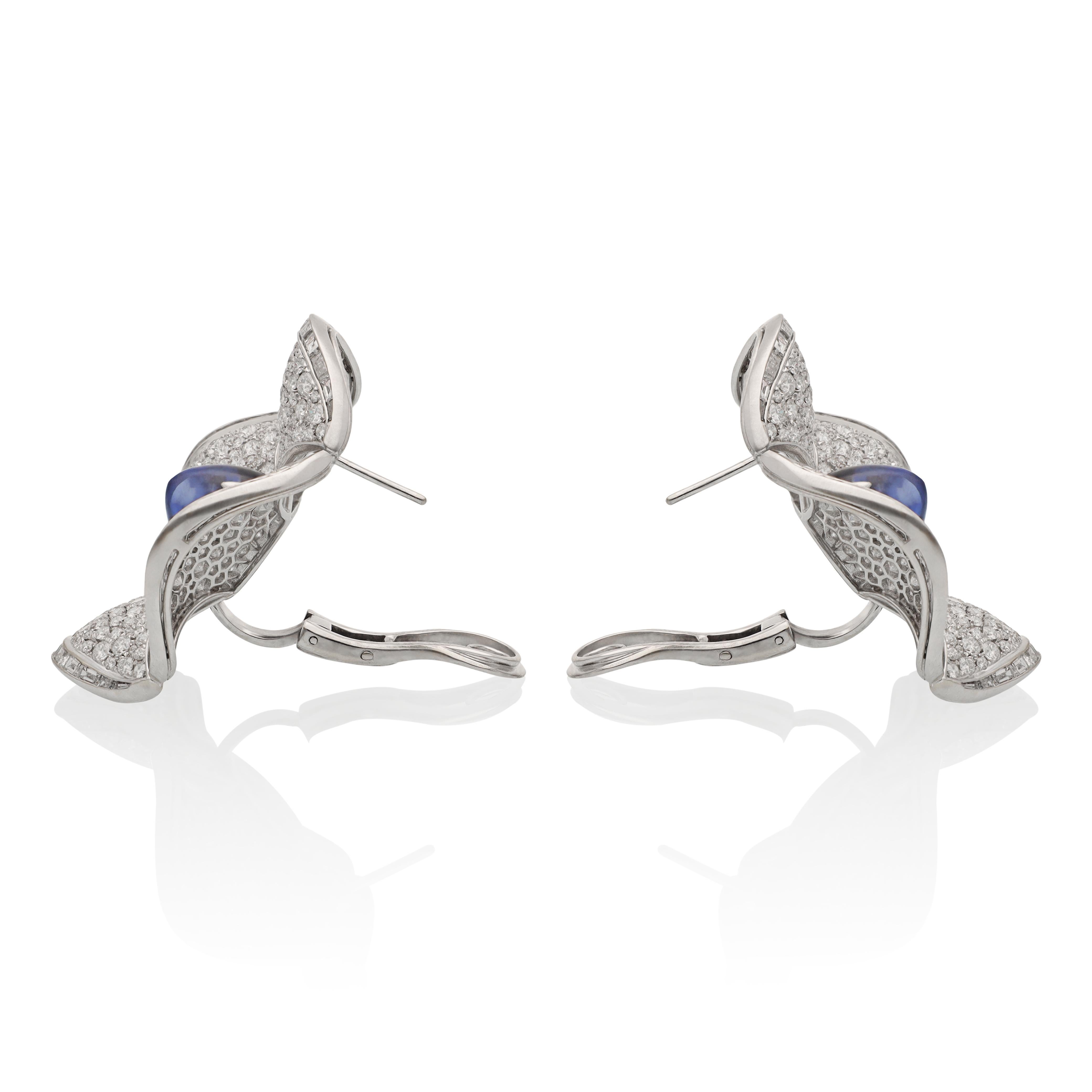 The Maltese Flower, also referred to as the Maltese Cross, flourishes in full sunlight, akin to the individual who adorns these exquisite ear clips. Crafted from 18K white gold, the ear clips feature a sophisticated arrangement of diamonds and