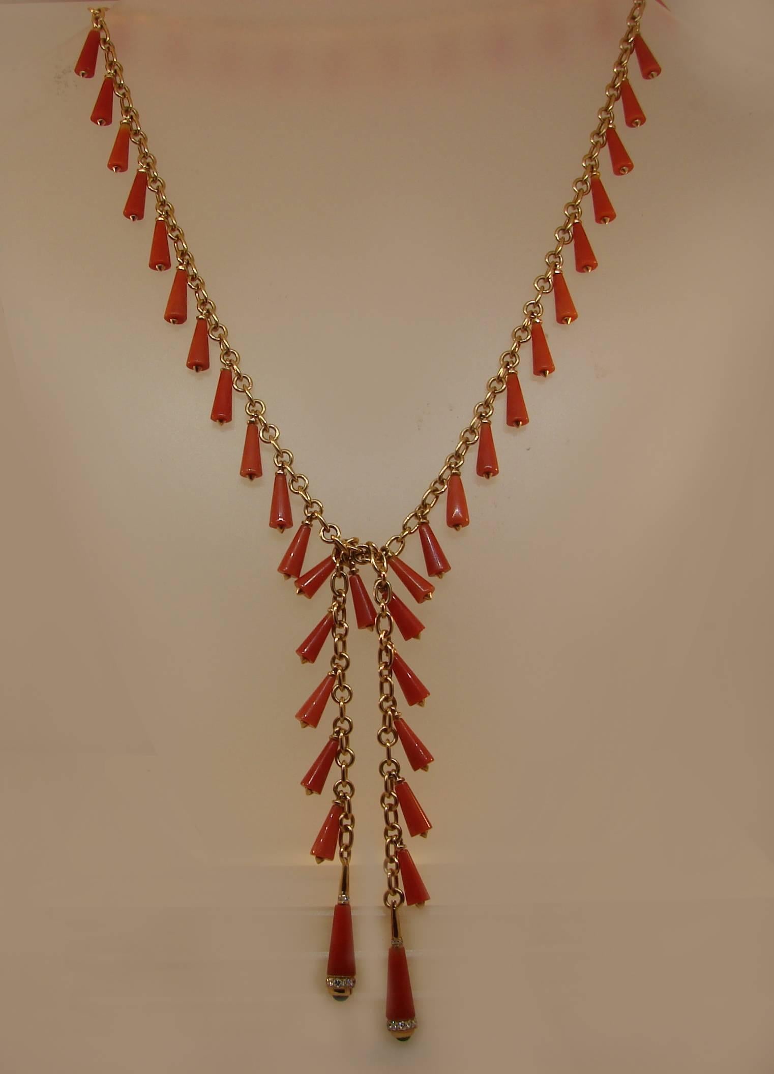 Lovely and fun coral necklace created by Bulgari in Italy in the 1970's. Features fine quality Mediterranean coral cones hanging on a 18 karat yellow gold chain and ending with two cones accented with round brilliant  cut diamonds and round cabochon
