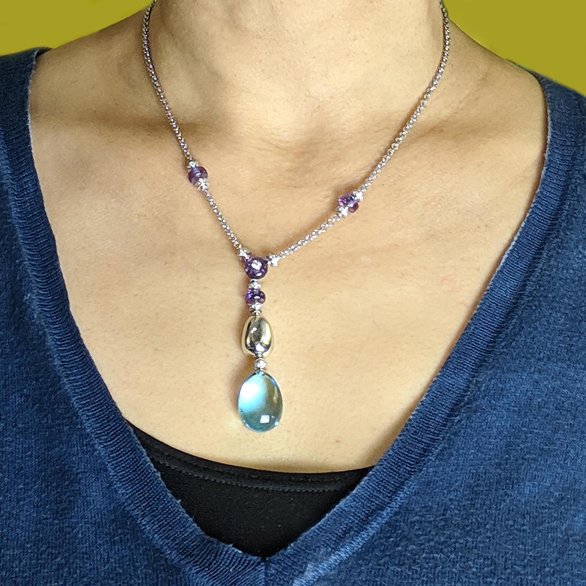 Authentic BULGARI 18K white gold diamond topaz drop pendant necklace. Lariat style necklace is from the Mediterranean Eden collection with Diamond spacers, Amethyst and a large Topaz drop.

Diamonds weigh around 0.90 carat in total, in G color & VS